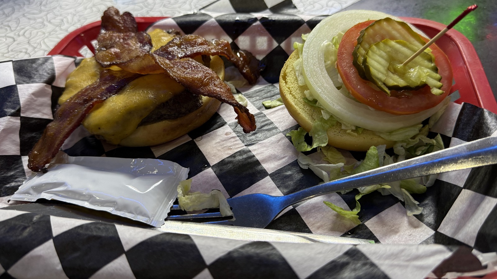 Bacon cheeseburger loaded with toppings at Mel's Classic Diner
