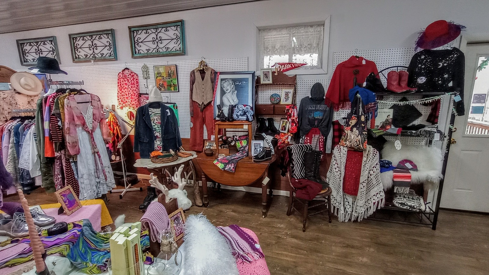 Vintage clothing, hats, framed art, and music-themed collectibles at Brown County Antique Mall