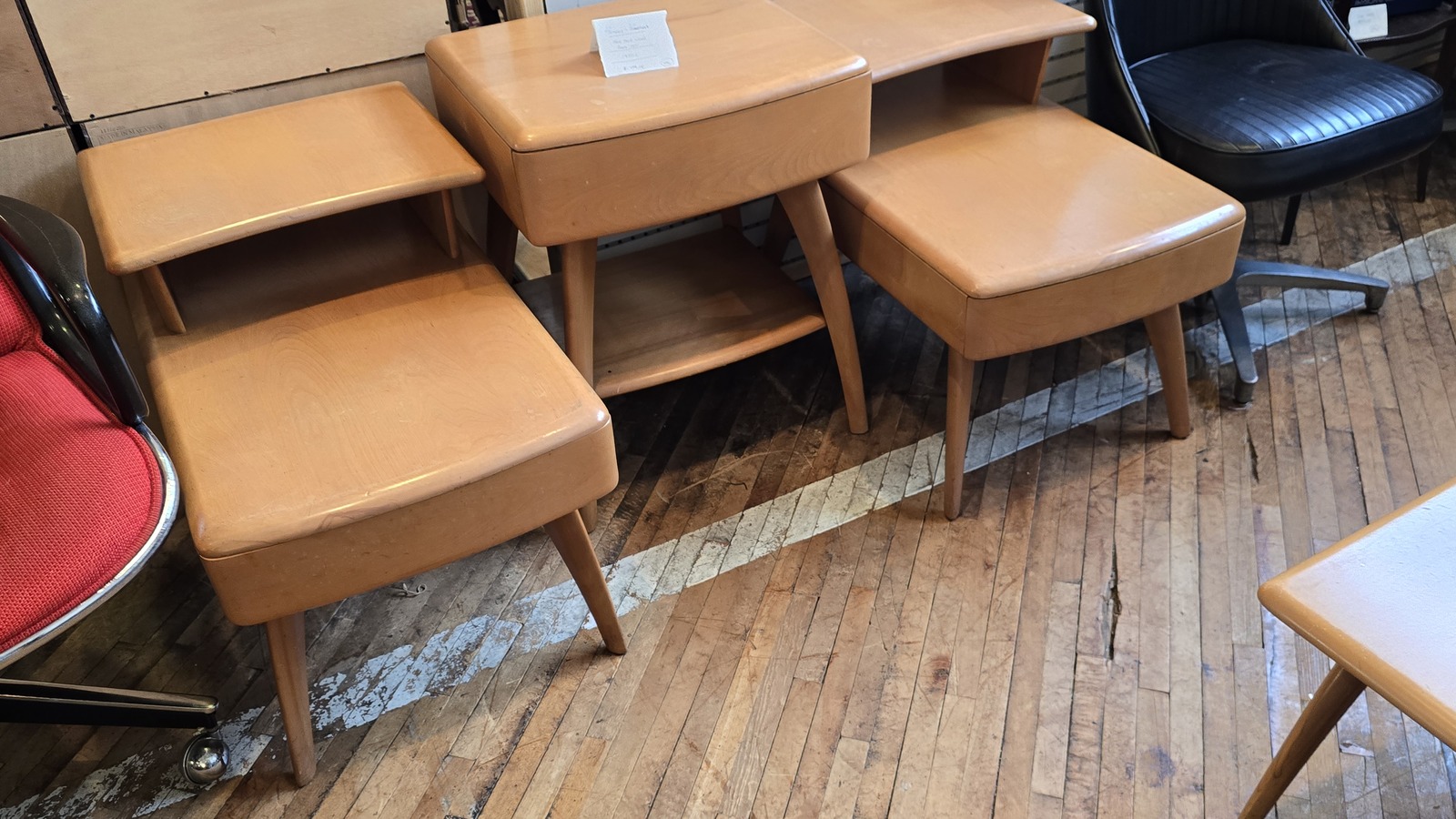 Mid-century table and side-chair set displayed on worn wood floors at Midland Arts & Antiques Market