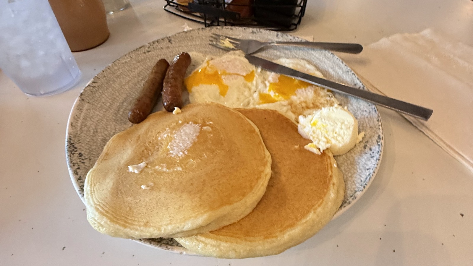 Classic pancake breakfast with eggs and sausage at The Pancake Pantry