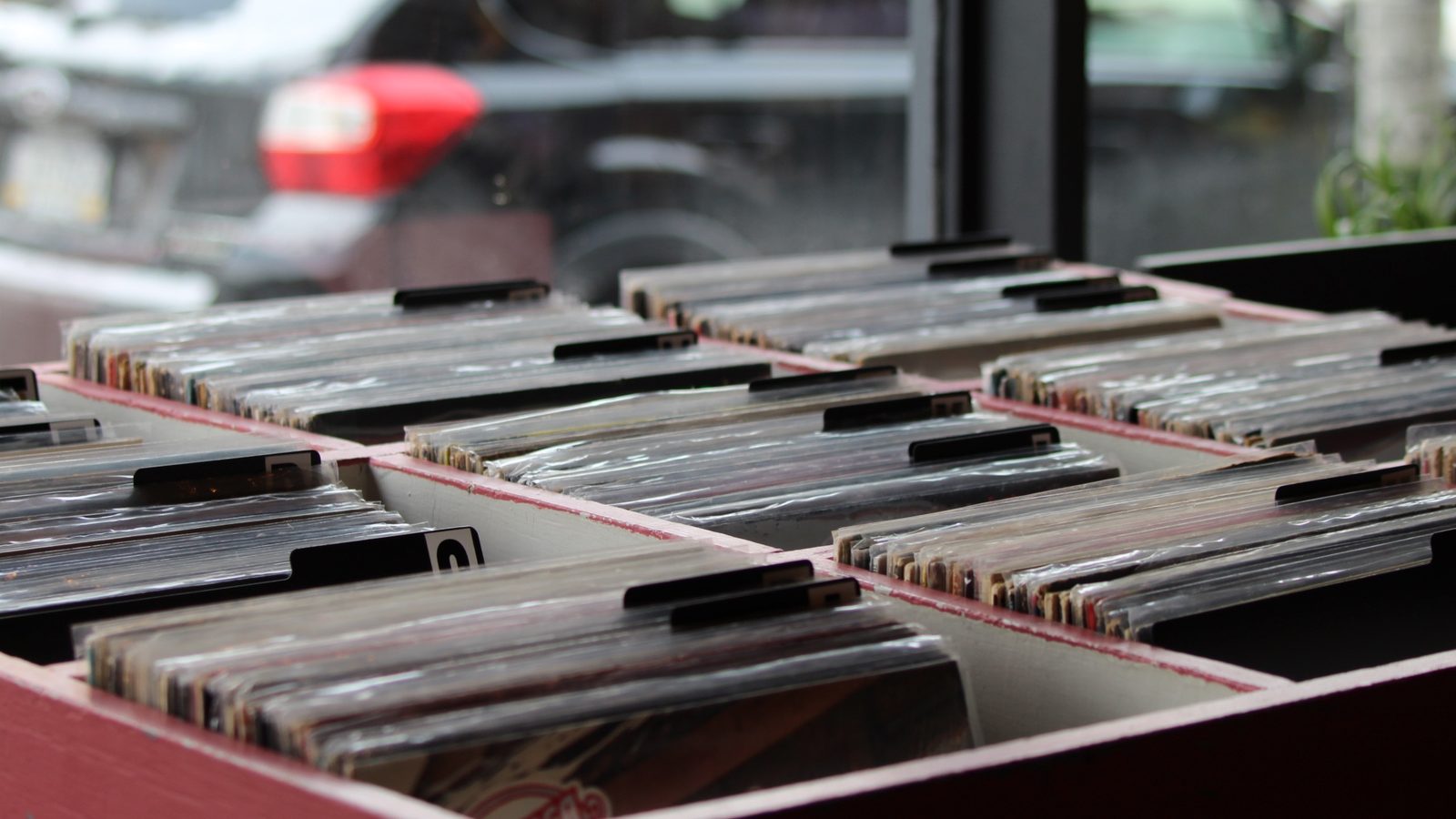 Record bins lined up beside the front window at Fifty One Ten Vintage in Pittsburgh.