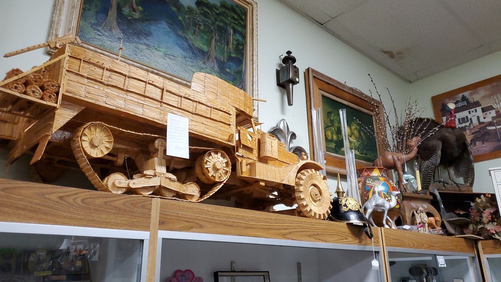 Wooden wagon display high above a booth at Treasure Mart Antique Mall