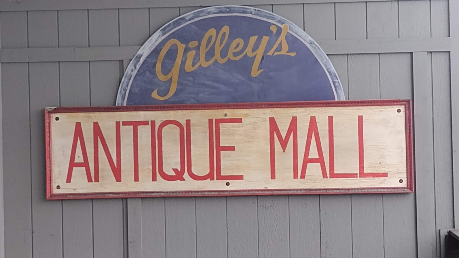 Gilley's Antique Mall sign mounted on an interior wall in Plainfield