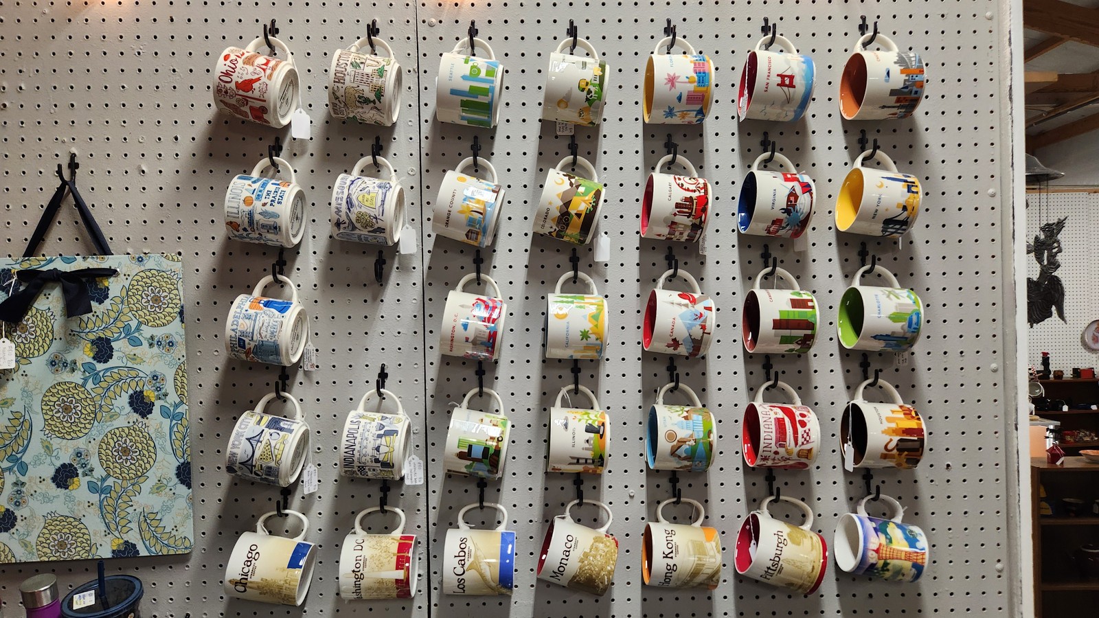 Rows of hanging vintage mugs inside Gilley's Antique & Decorator Mall