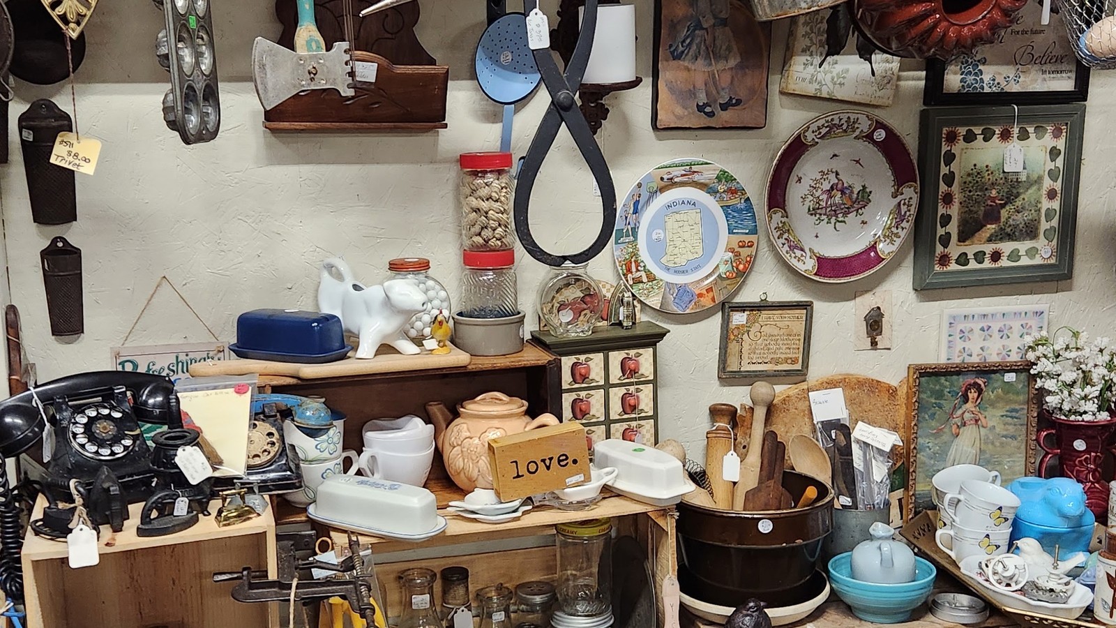 Densely packed primitives and decor shelves inside Gilley's Antique & Decorator Mall