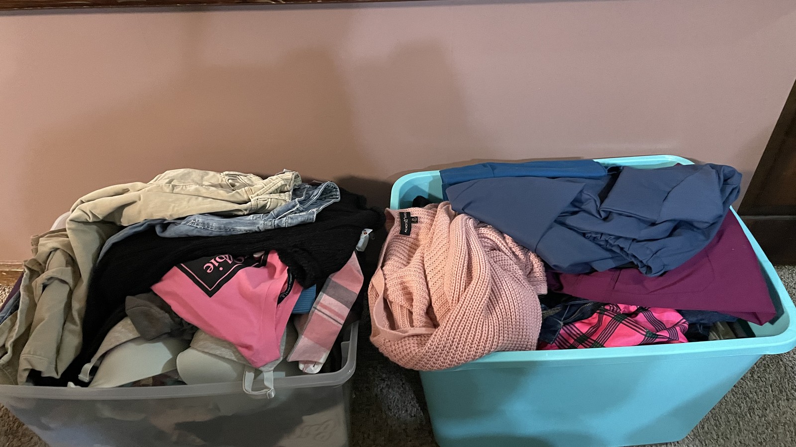 Freshly sorted clothing laid out in bins at Uptown Cheapskate West York in York.