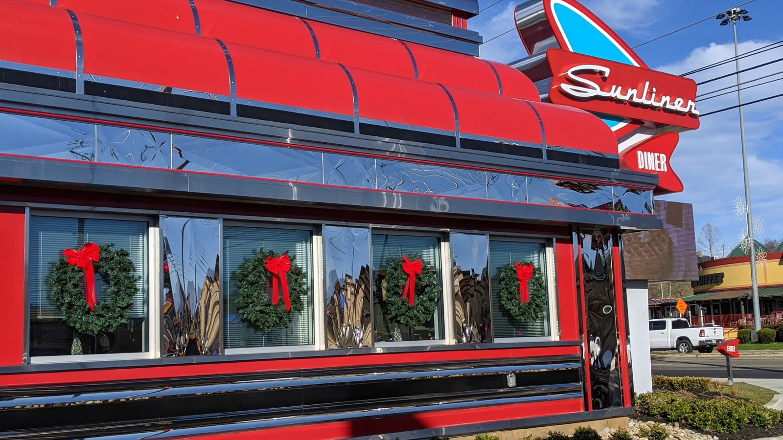 Chrome diner windows and red awnings at Sunliner Diner in Pigeon Forge