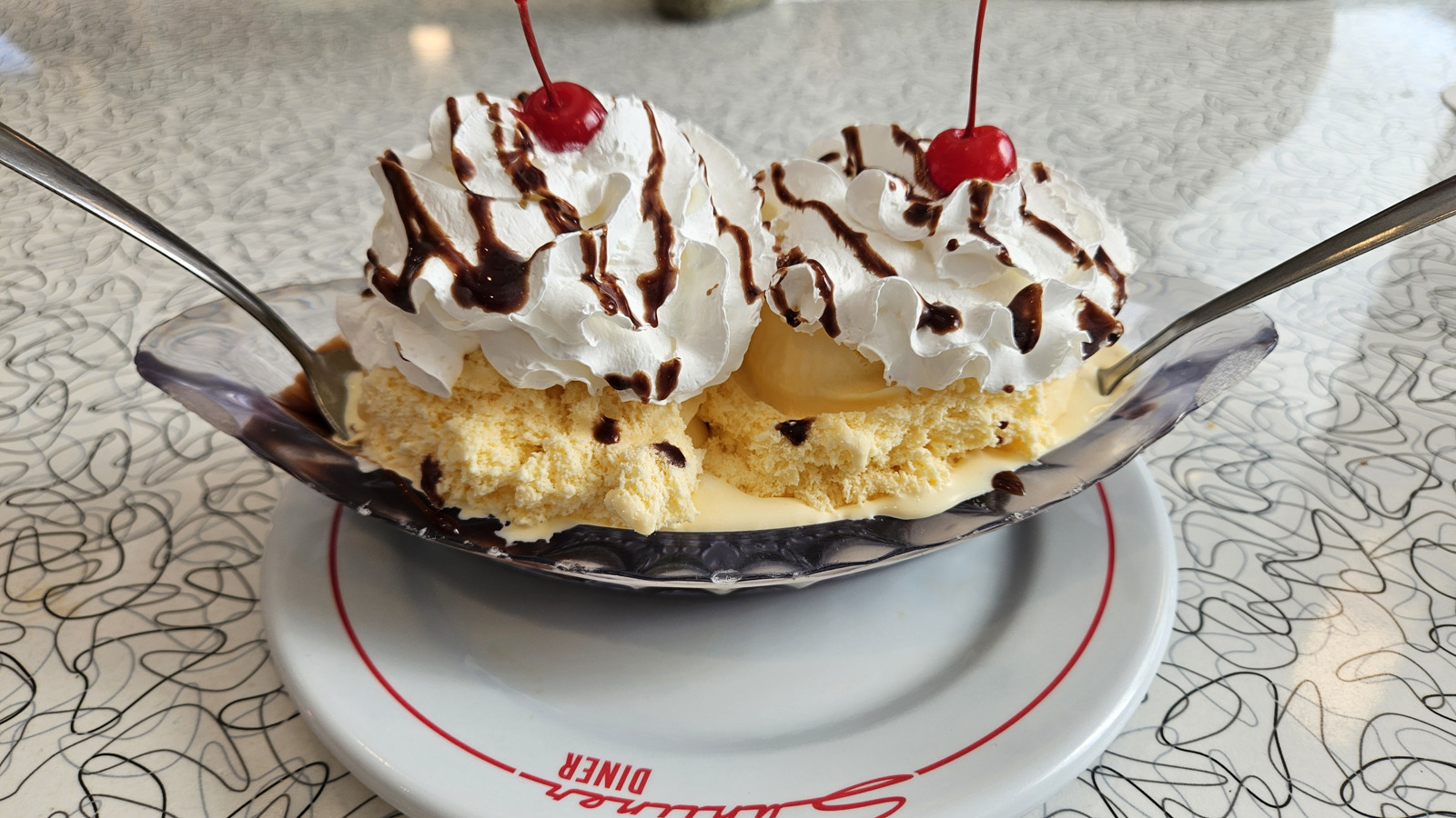 Classic banana split with whipped cream and cherries at Sunliner Diner