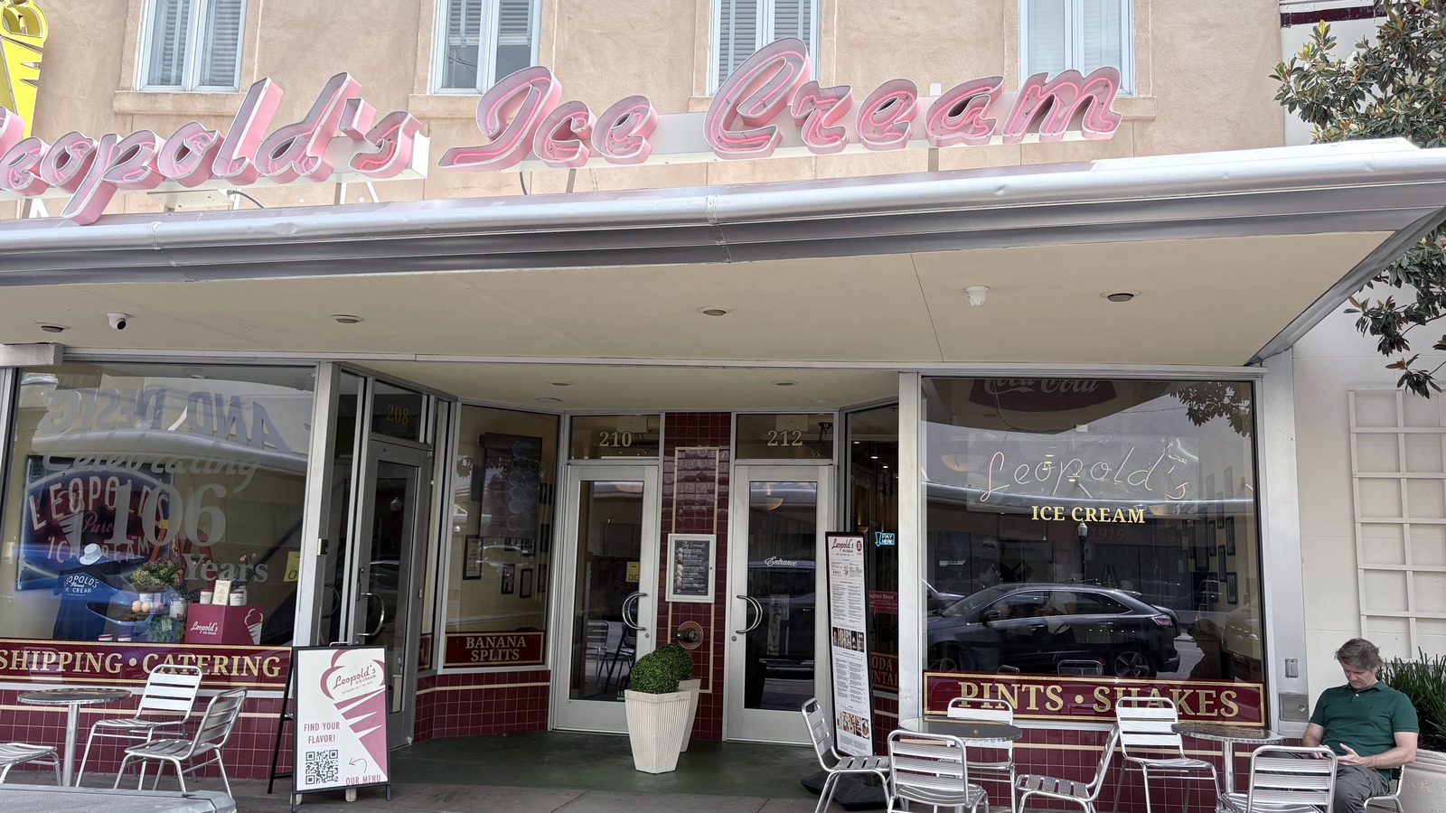 Leopold's Ice Cream entrance and pink sign above the Broughton Street sidewalk tables