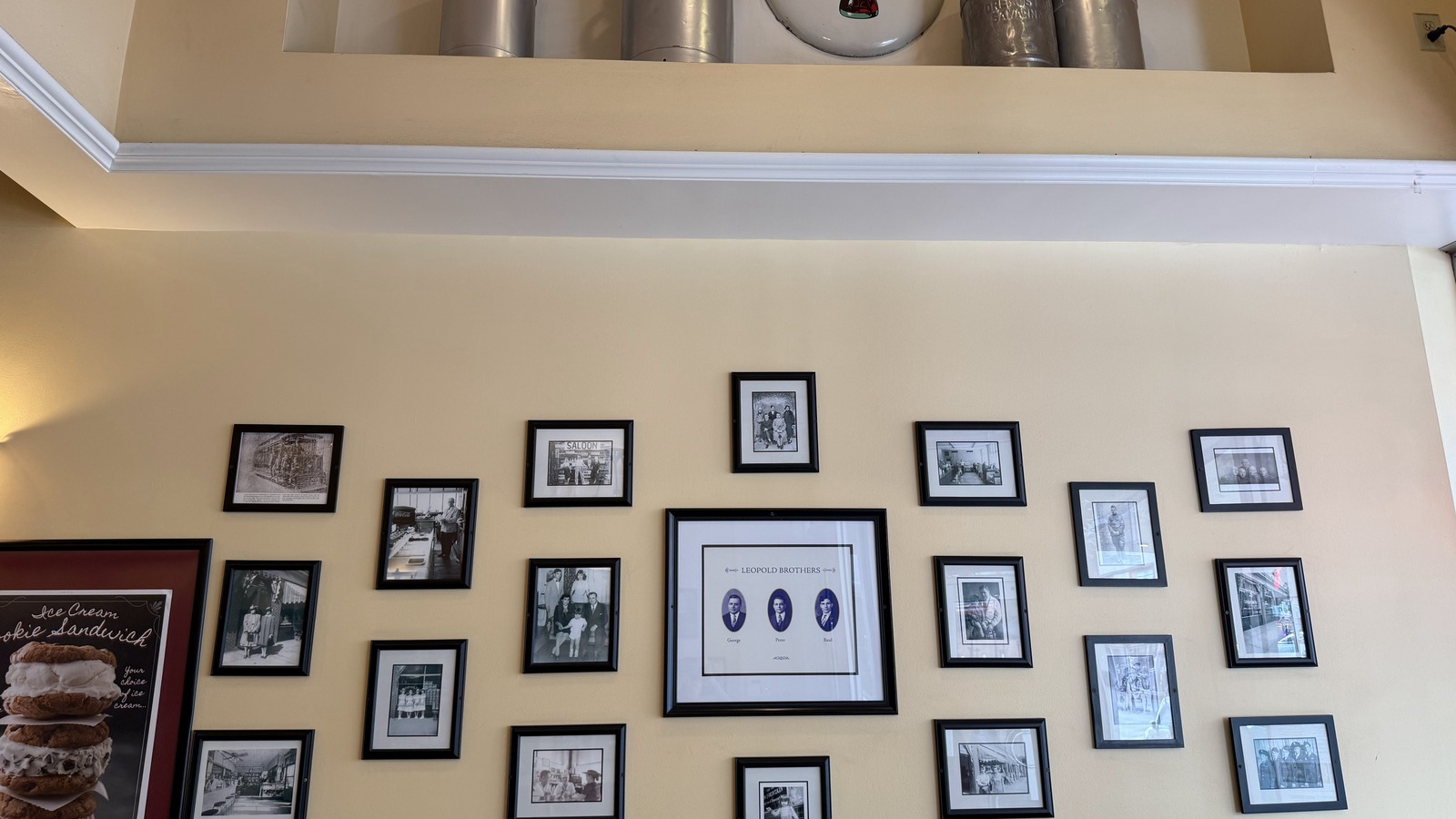 Framed Leopold family photos and vintage dairy pieces inside the Broughton Street shop