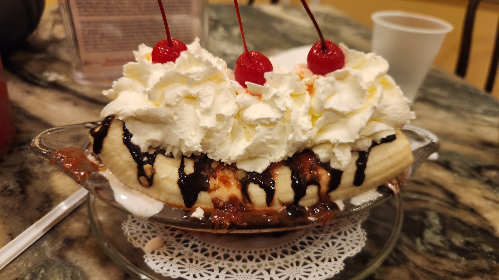 Banana split topped with whipped cream and cherries at Leopold's Ice Cream