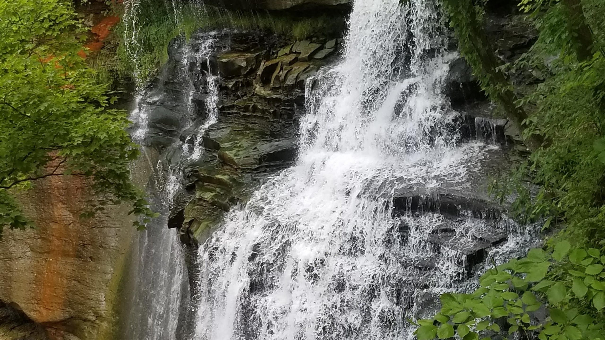 Close overlook view of Brandywine Falls spilling across layered stone