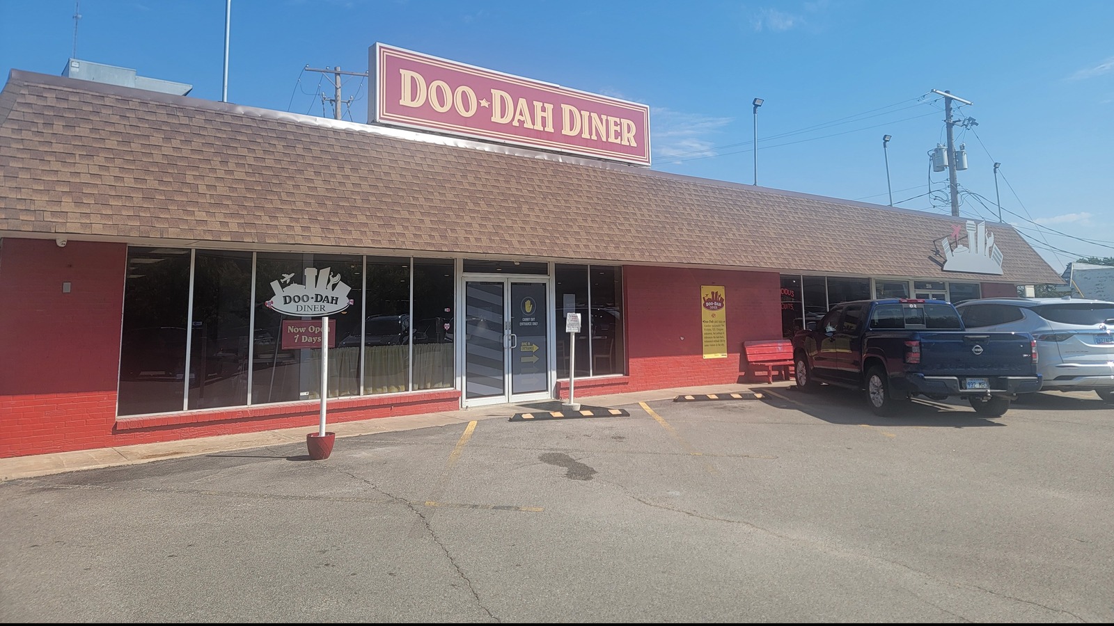 Doo-Dah Diner storefront with red trim and rooftop sign in Wichita