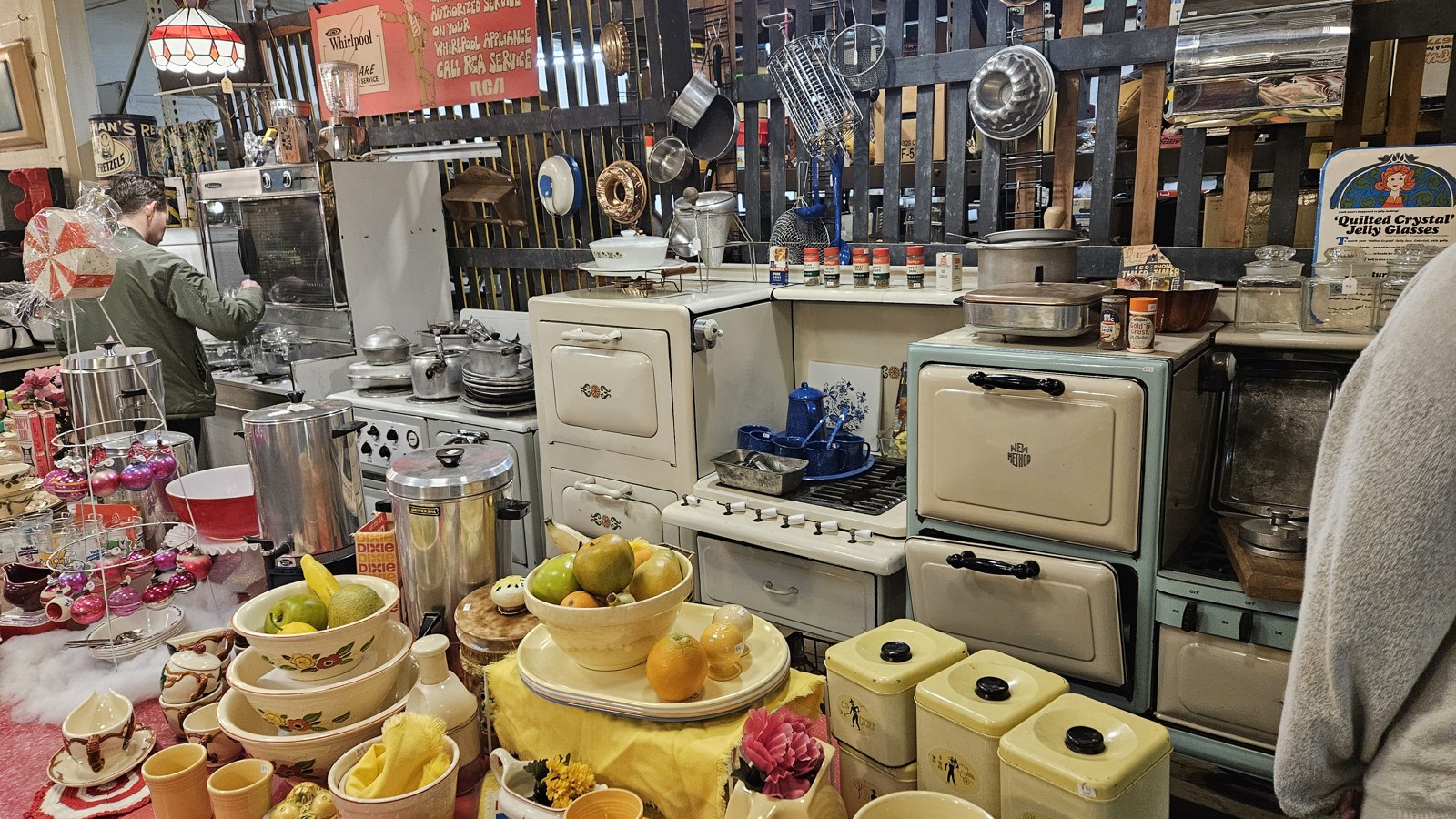 Vintage kitchenware, mixers, and hanging hardware inside The Bomb Shelter