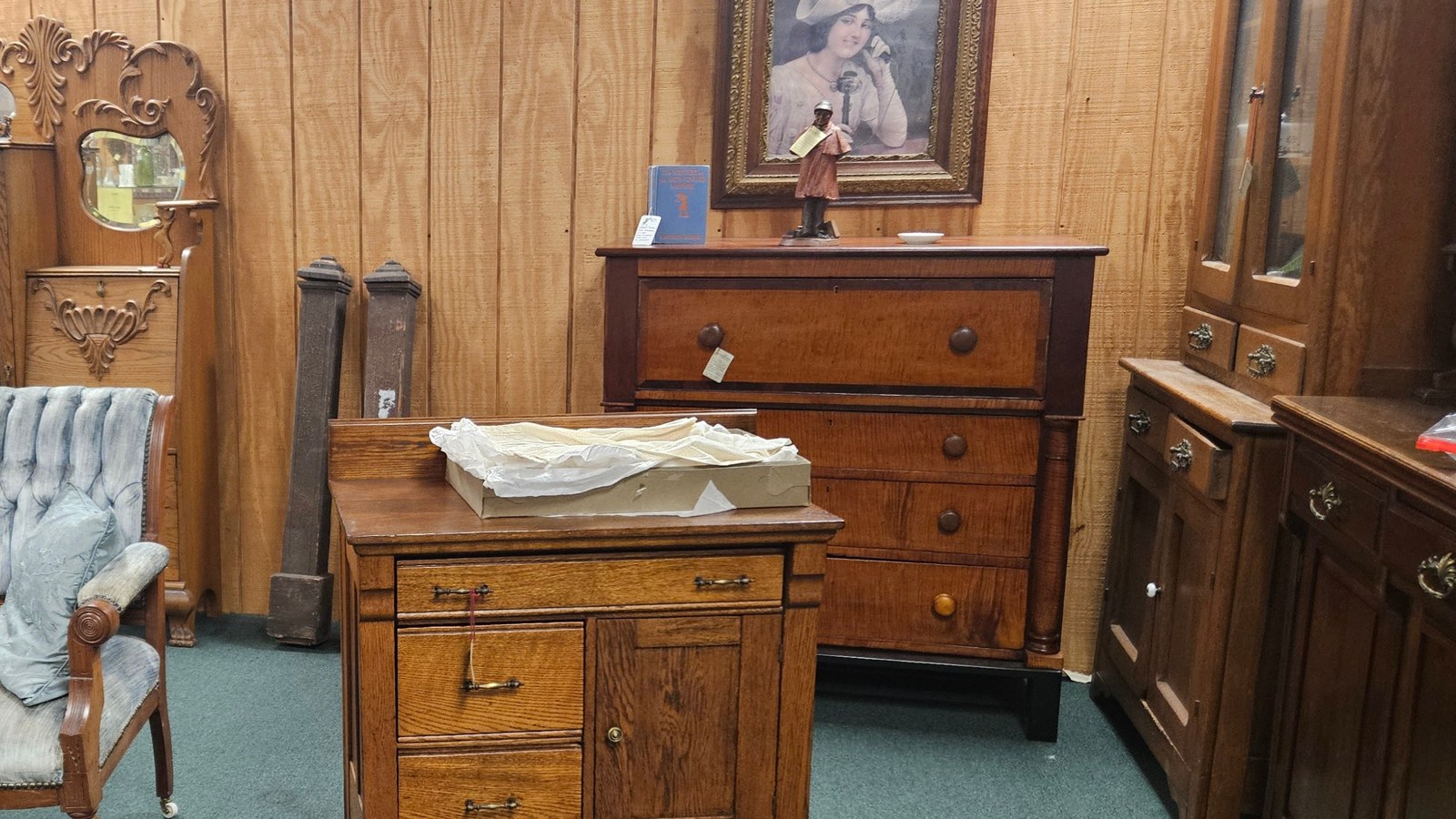 Furniture room with wood cabinets, dressers, and tables inside I-76 Antique Mall