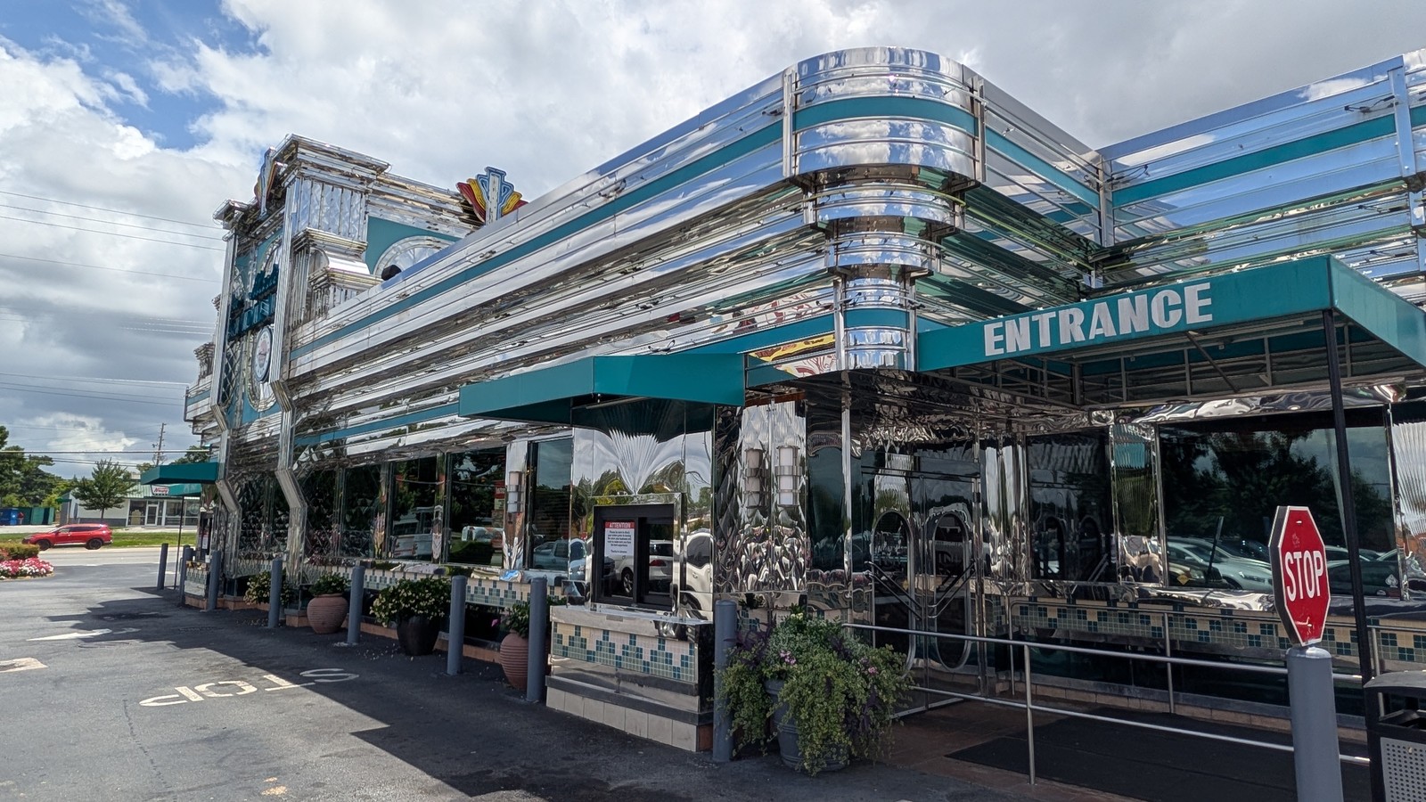 Chrome-front Marietta Diner with teal awning and entrance on Cobb Parkway in Marietta