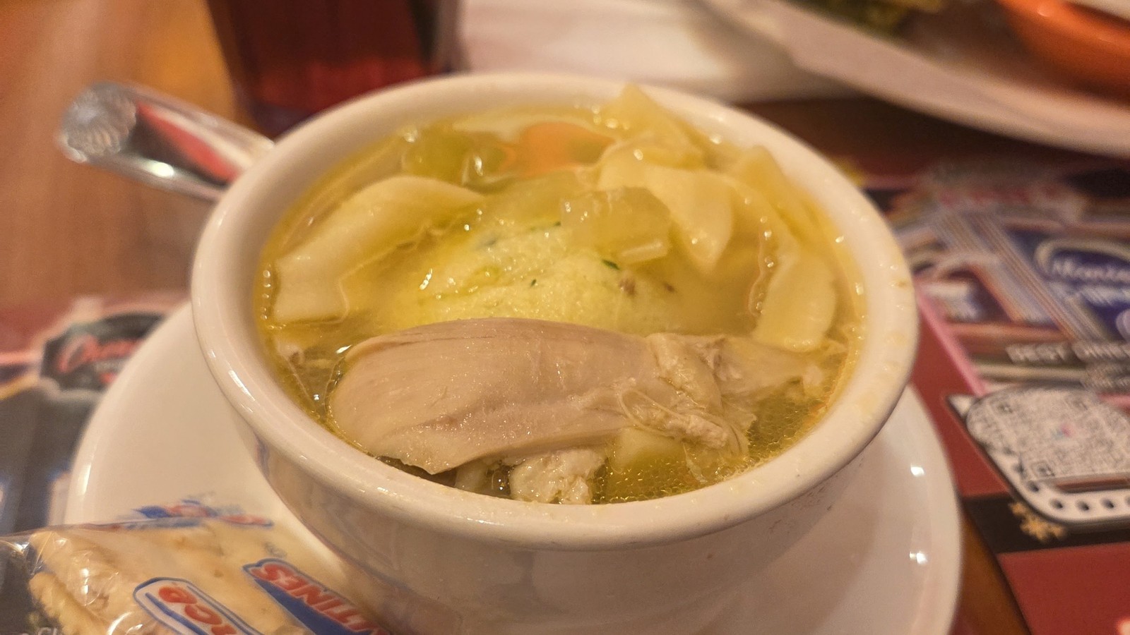 Steaming soup bowl with butter on a Marietta Diner table