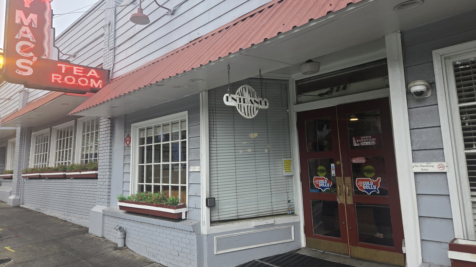Mary Mac's front door, sidewalk windows, and red awning on Ponce de Leon Avenue