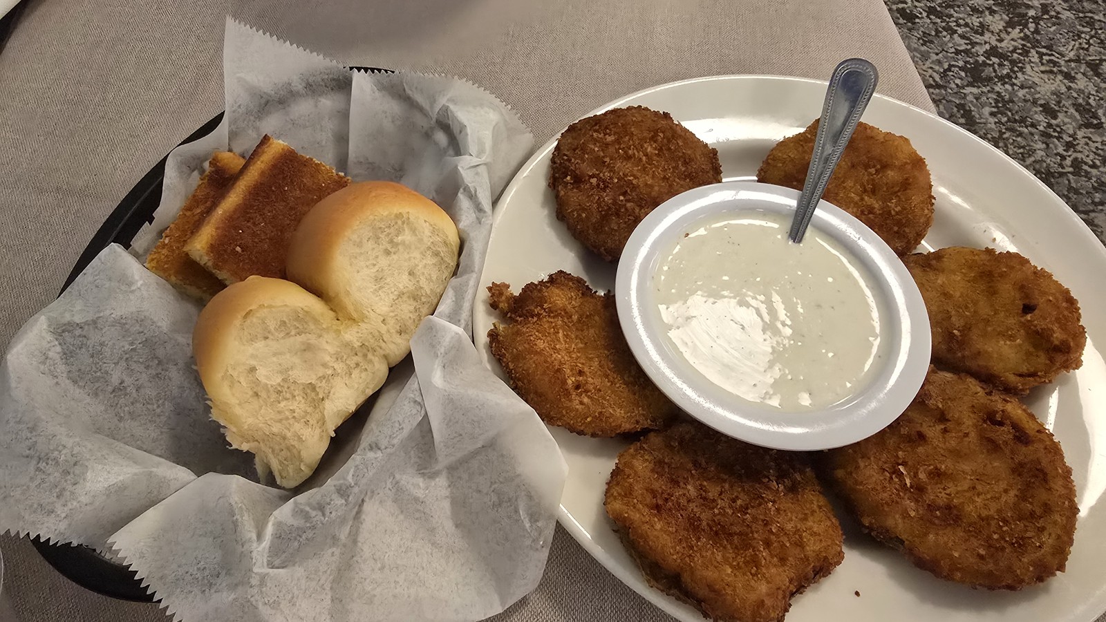 Warm rolls, cornbread, and fried starters with dipping sauce at Mary Mac's Tea Room