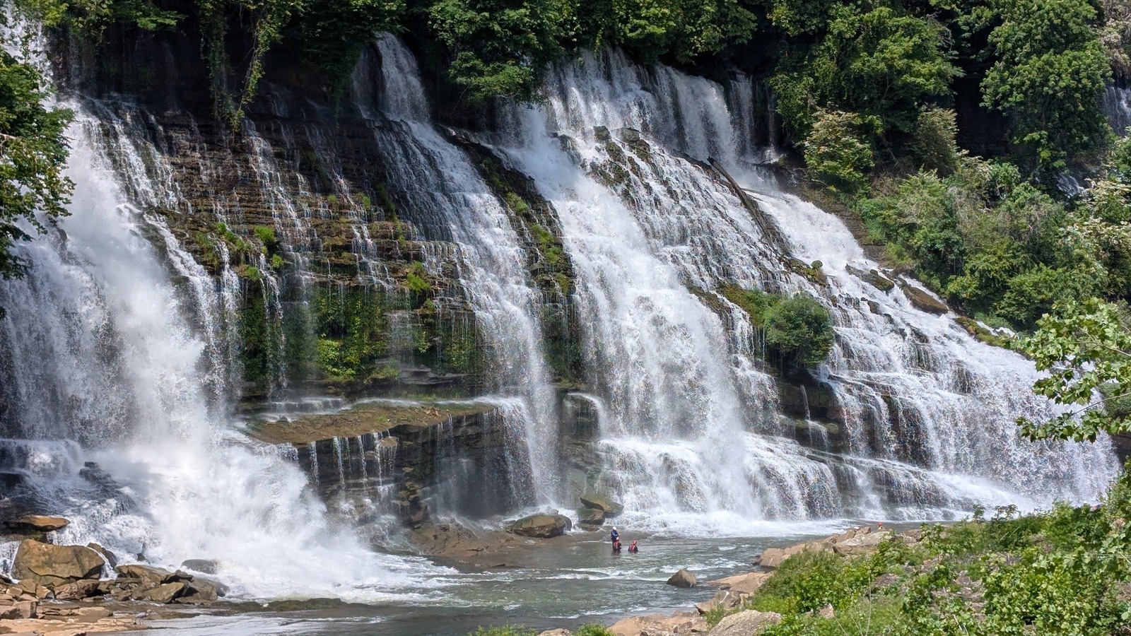 Twin Falls spreading across a broad rock face at Rock Island State Park.