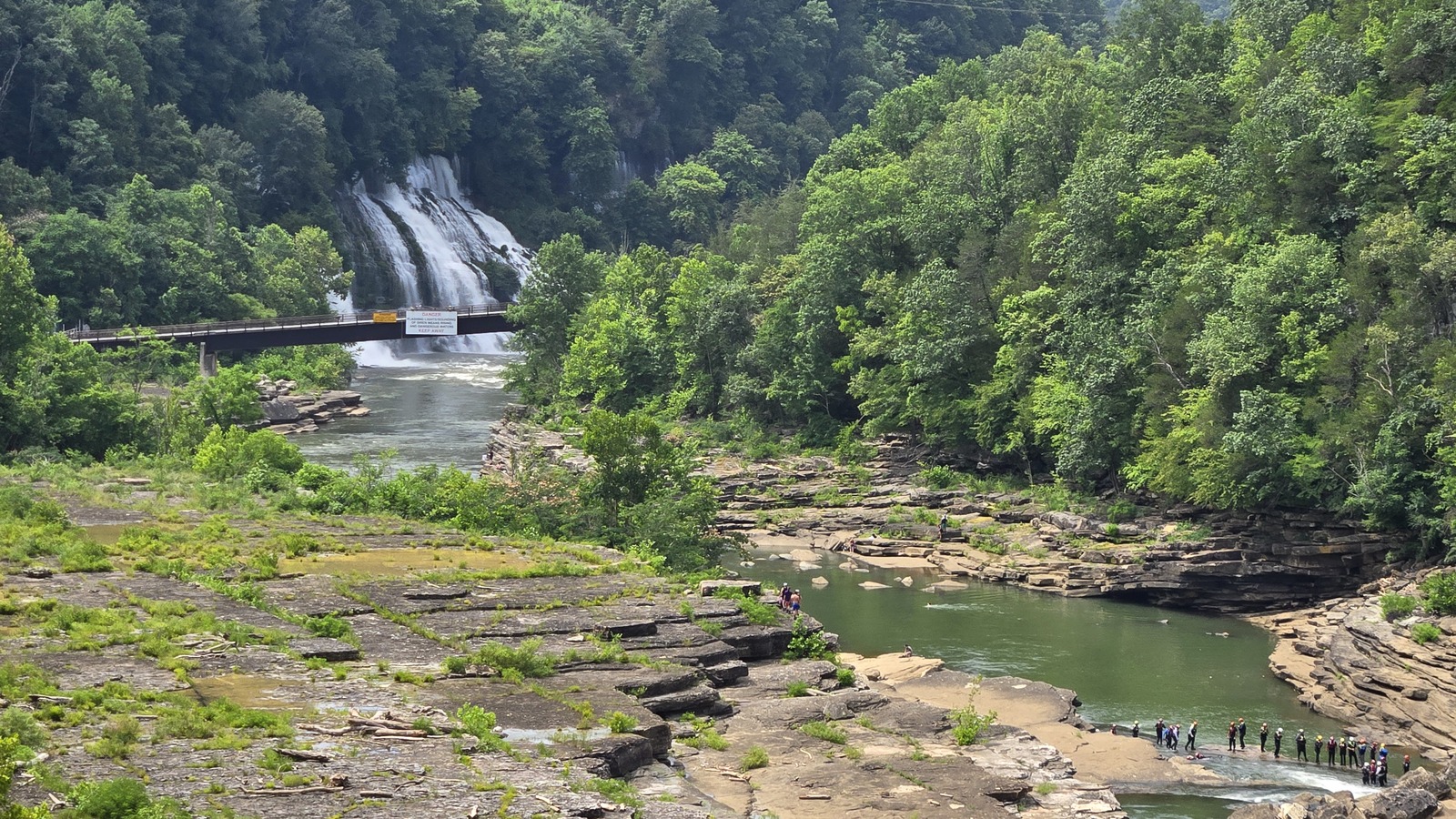 Limestone shelves and a wide river bend leading toward the falls at Rock Island State Park.