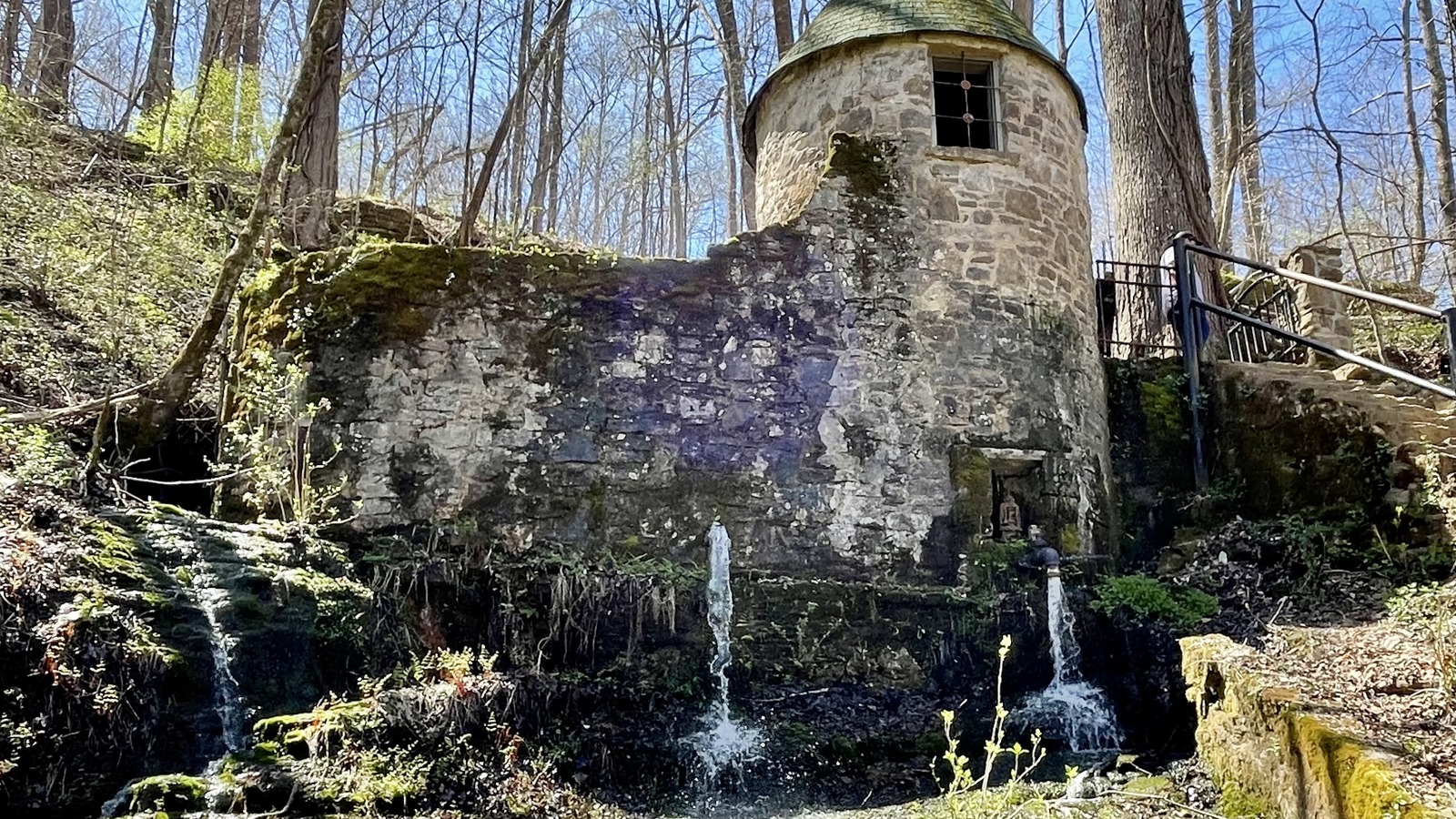 Stone spring house tucked into the hillside at Rock Island State Park.