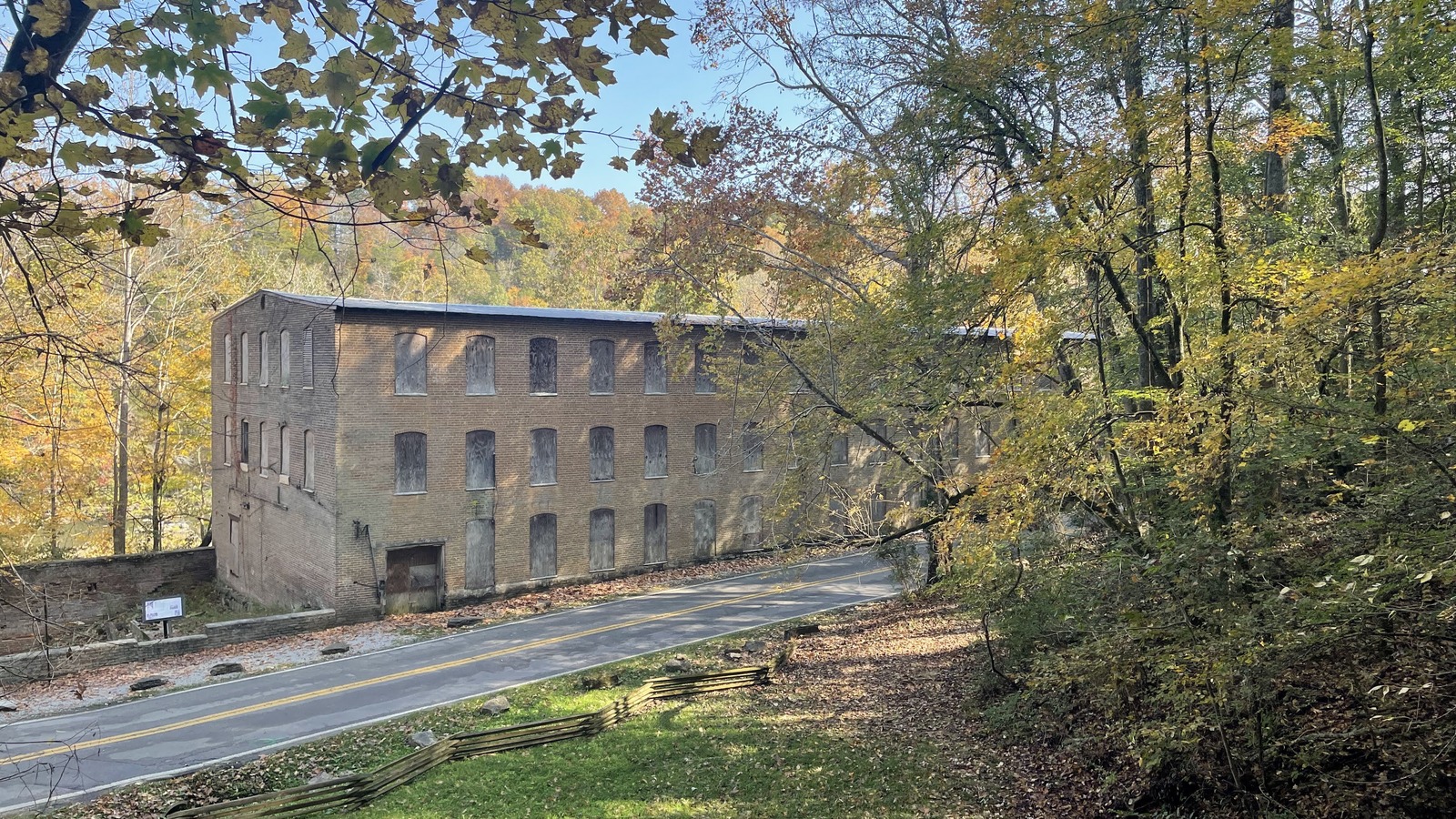 Historic cotton mill building above the roadway at Rock Island State Park.