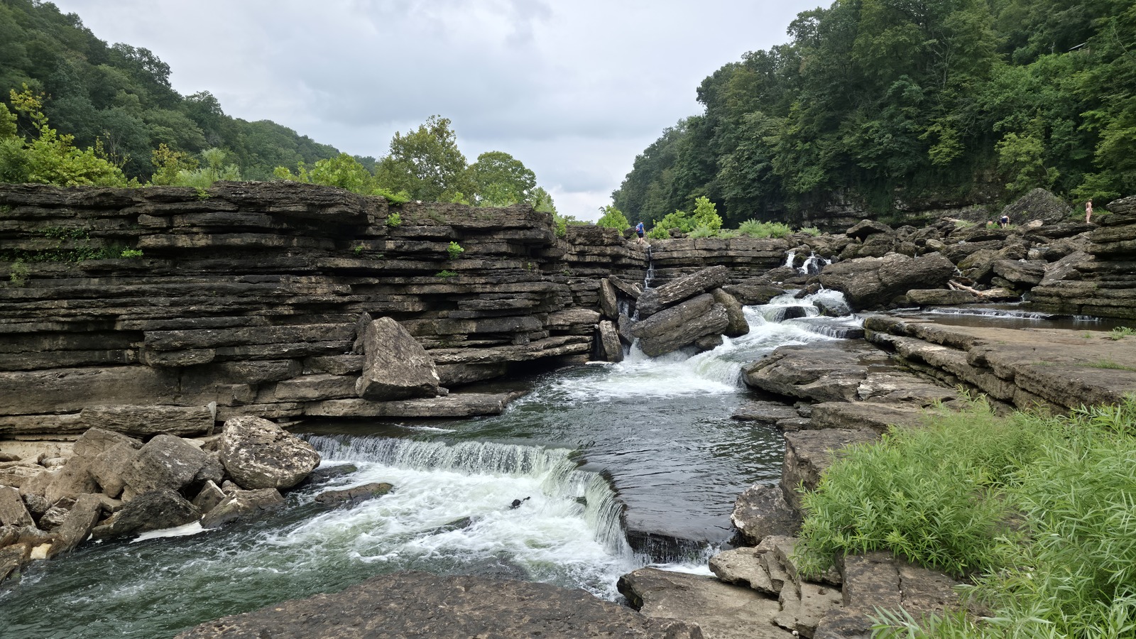 Flat river shelves and layered rock walls in the gorge at Rock Island State Park.