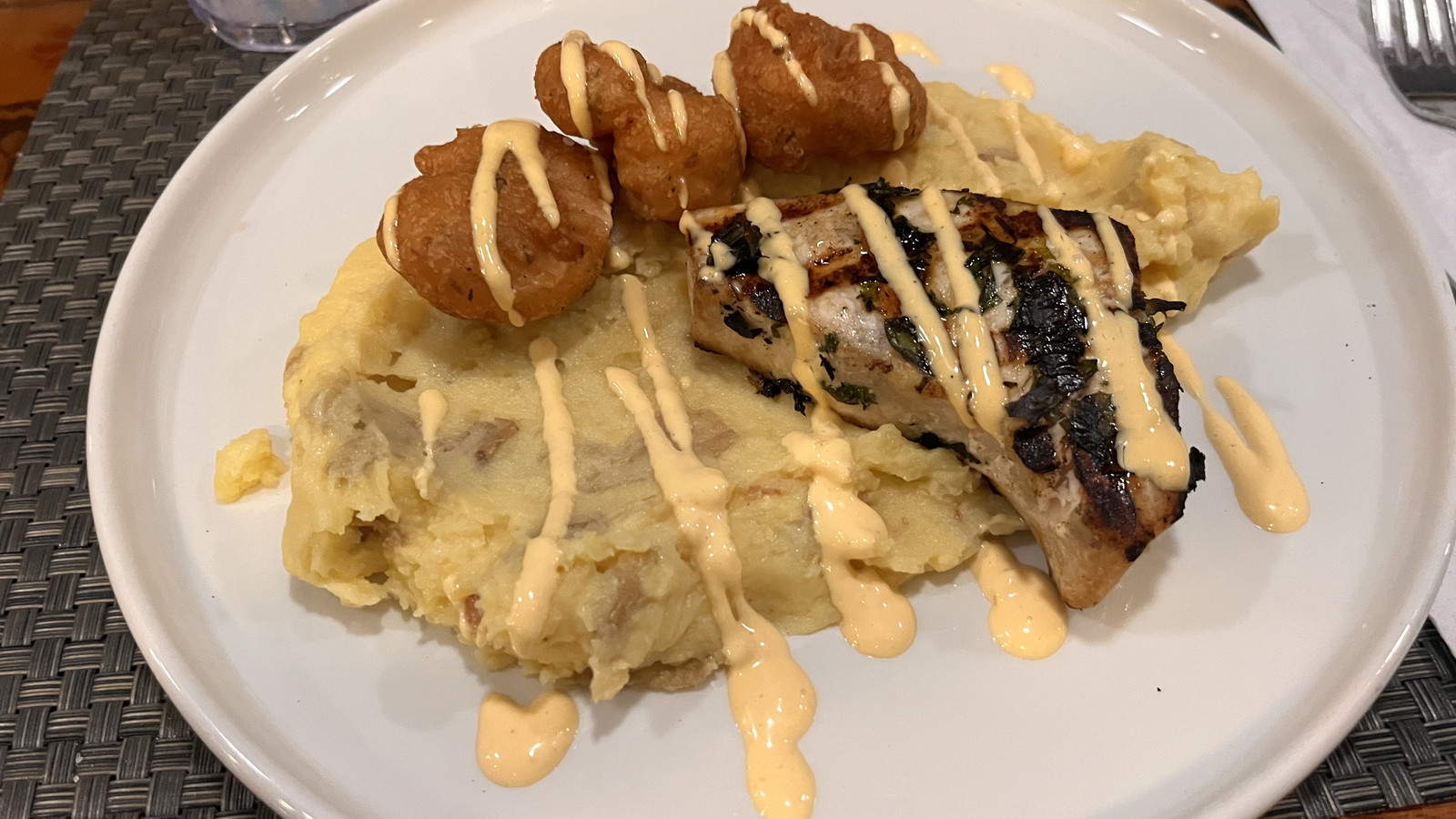 Grilled fish plate with potato mash and hush puppies at Little Moir's Food Shack