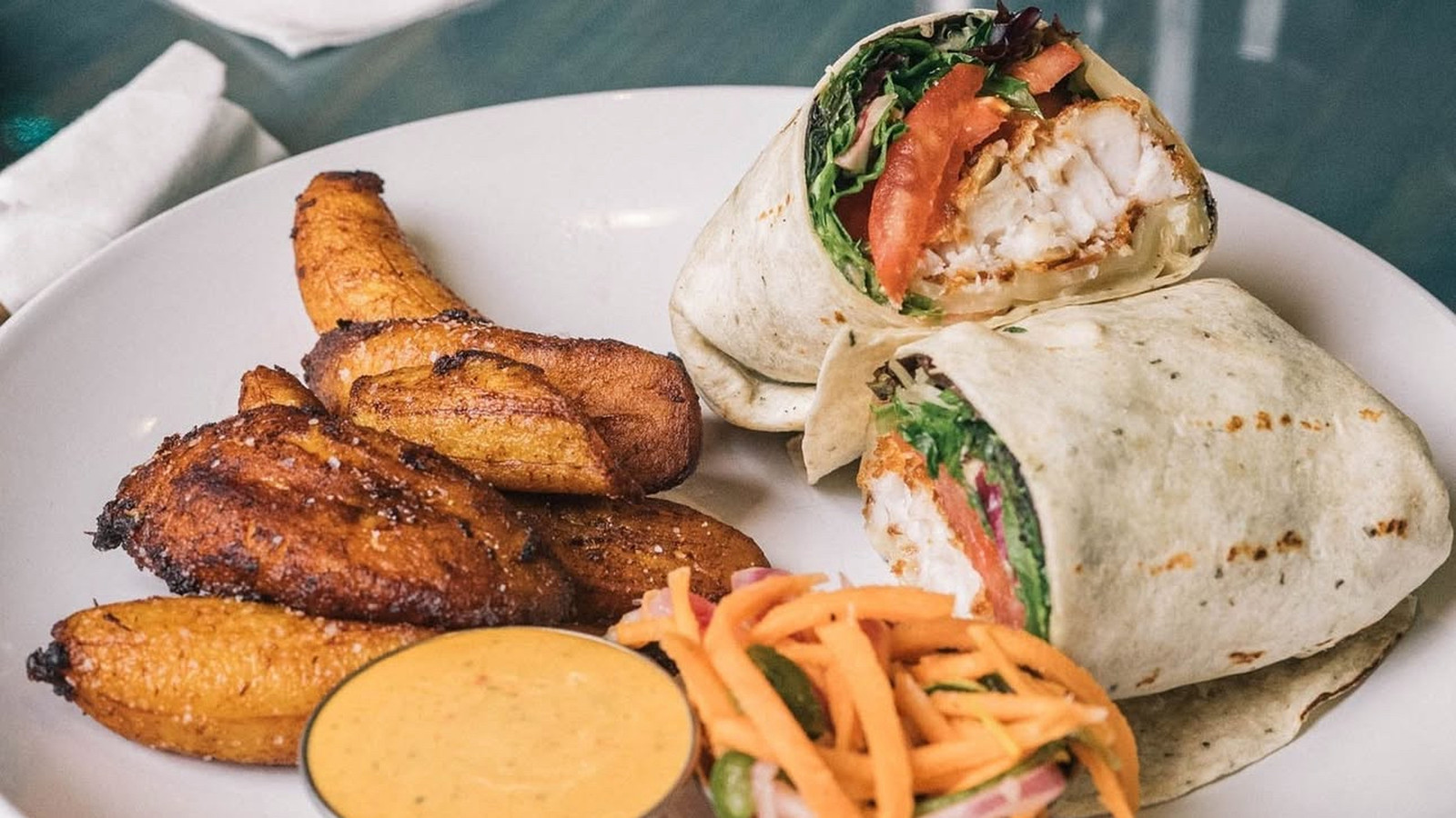 Blackened fish wrap with fried plantains and dipping sauce at Little Moir's Food Shack