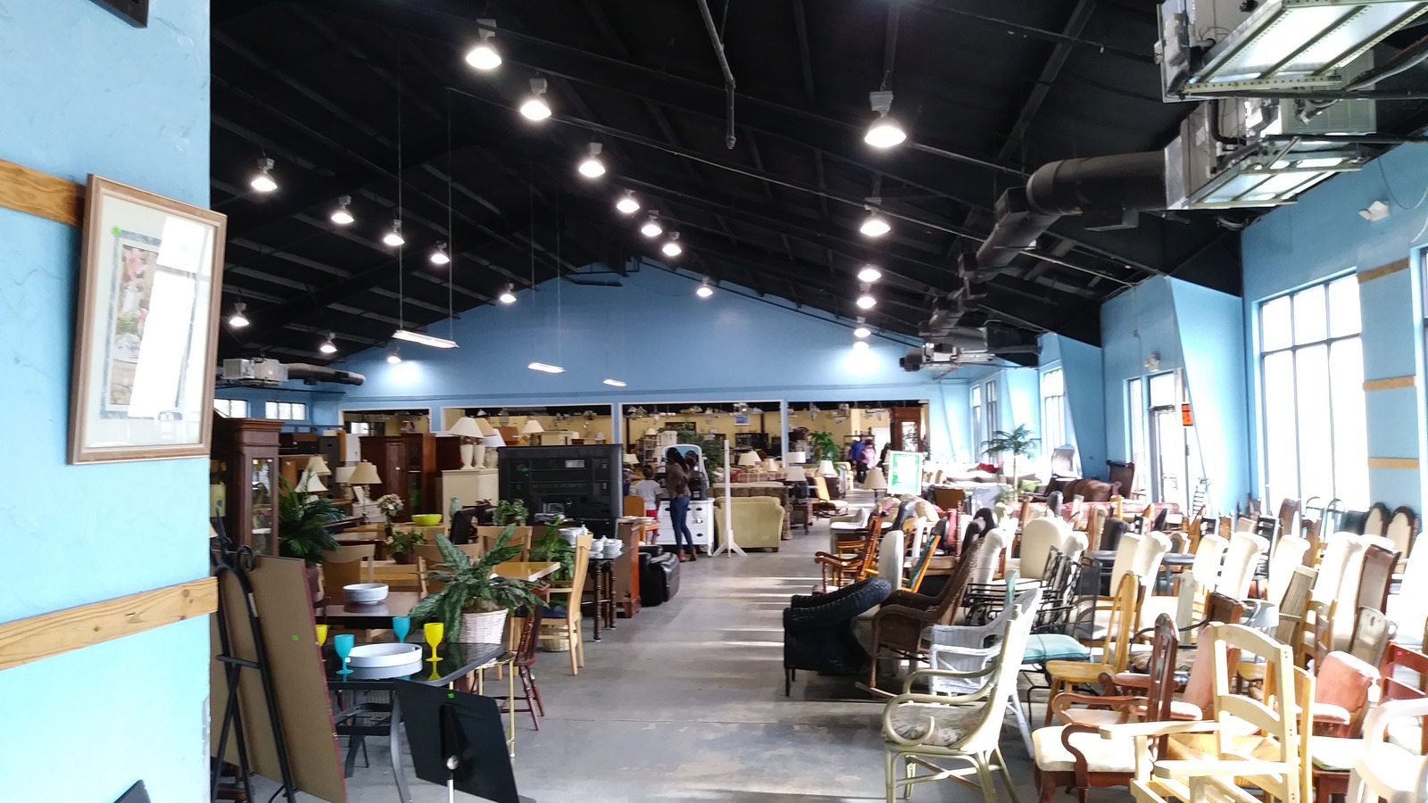 Furniture, framed art, and home decor across the Bluffton Habitat ReStore showroom