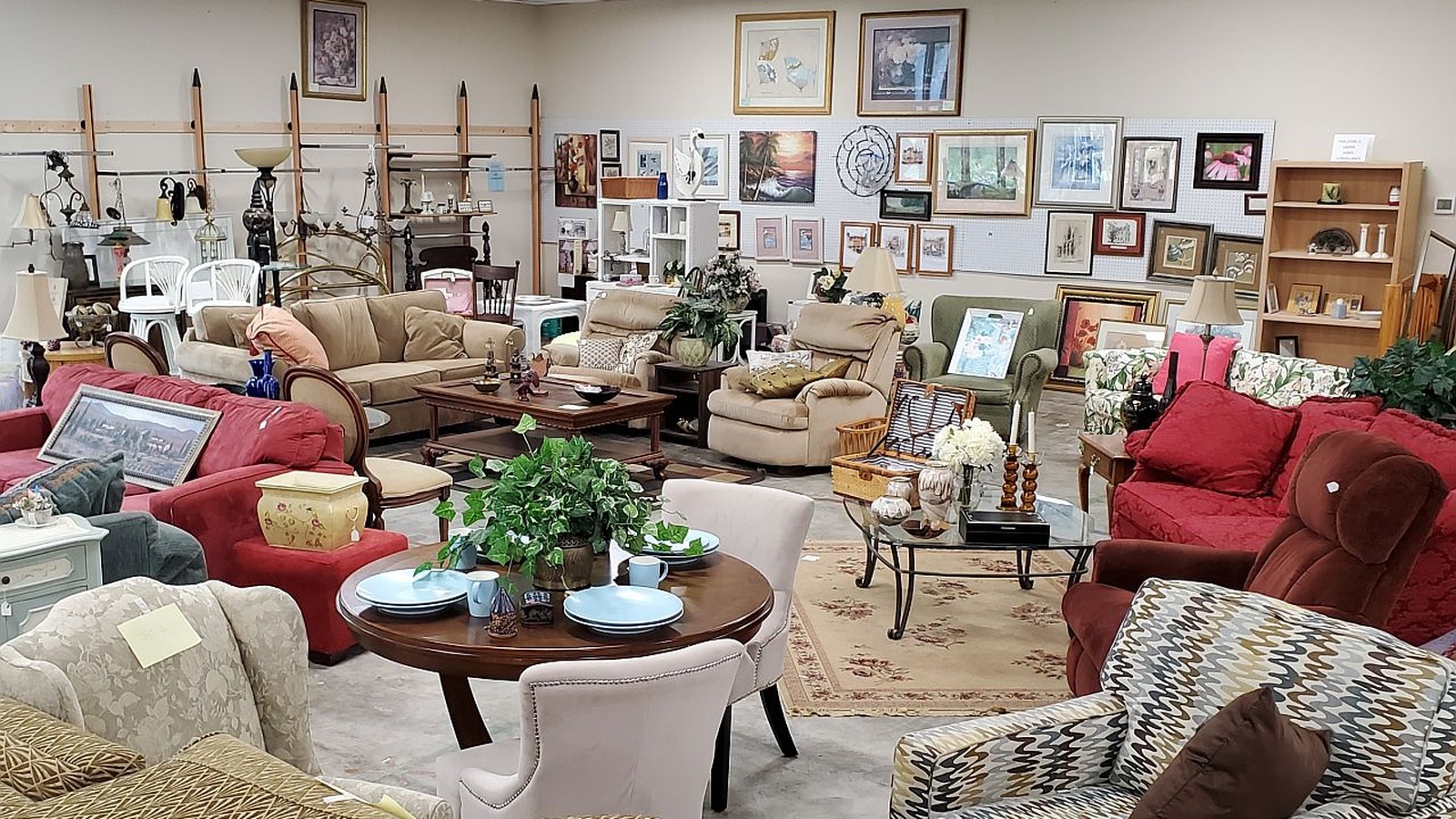 Sofas, tables, chairs, and framed art at Osprey Village Thrift on Main