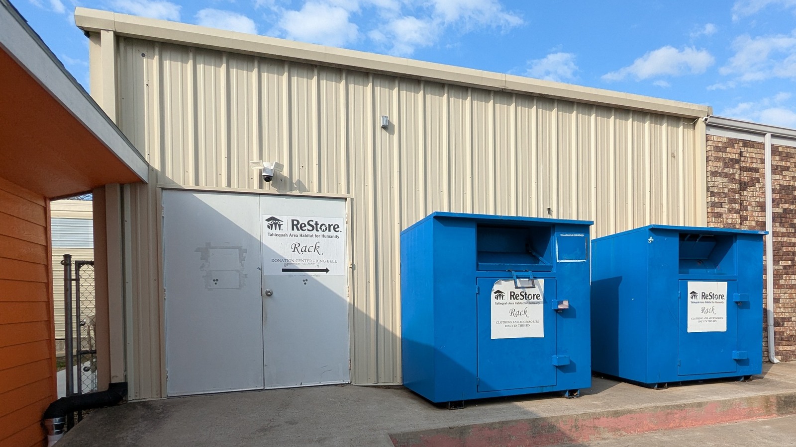 Tahlequah Habitat ReStore Rack storefront and donation bins on West First Street