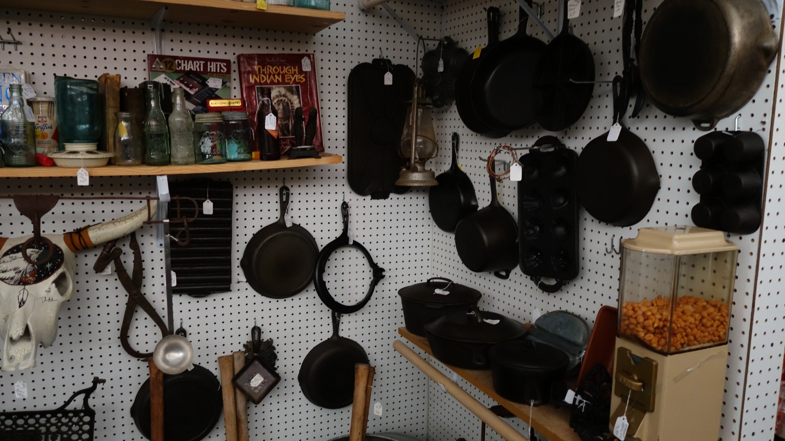 Cast-iron skillets and vintage kitchenware displayed at The Speckled Hen