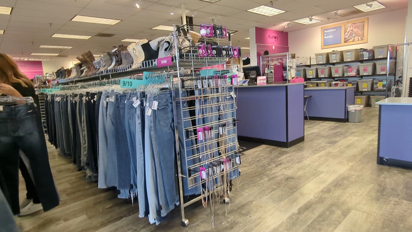 Organized jeans, clothing racks, and accessories at Plato's Closet Grand Forks