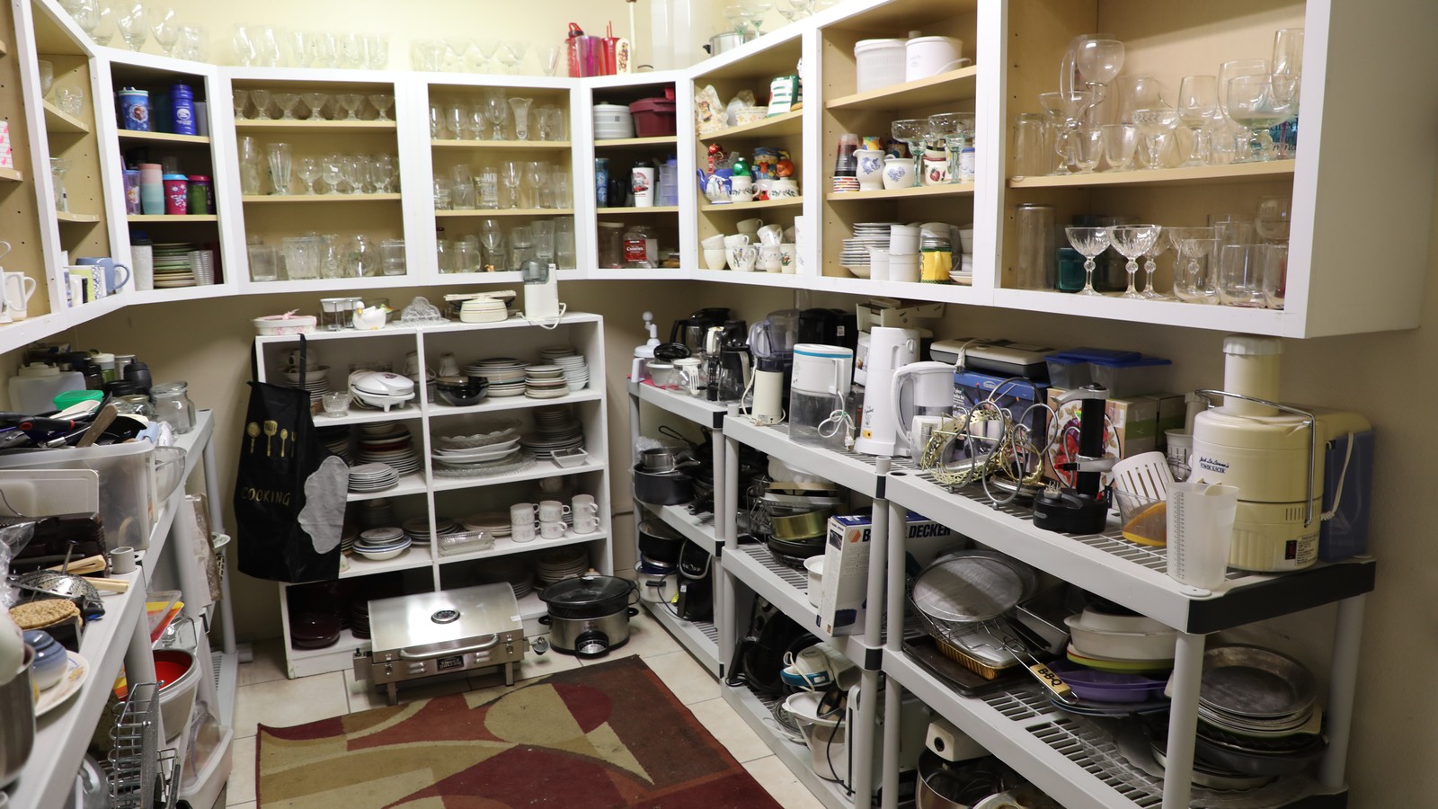 Shelves of dishes and housewares at Cornerstone Mission Thrift Shop