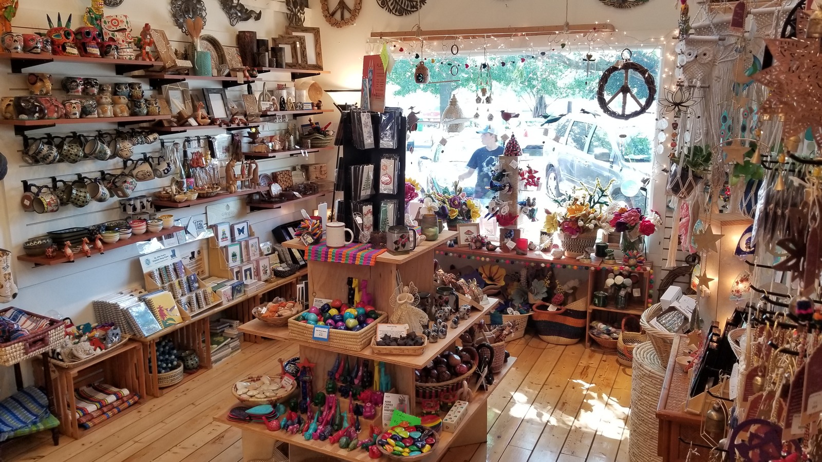 Colorful handcrafted gifts and decor inside Lucia's World Emporium in Saugatuck