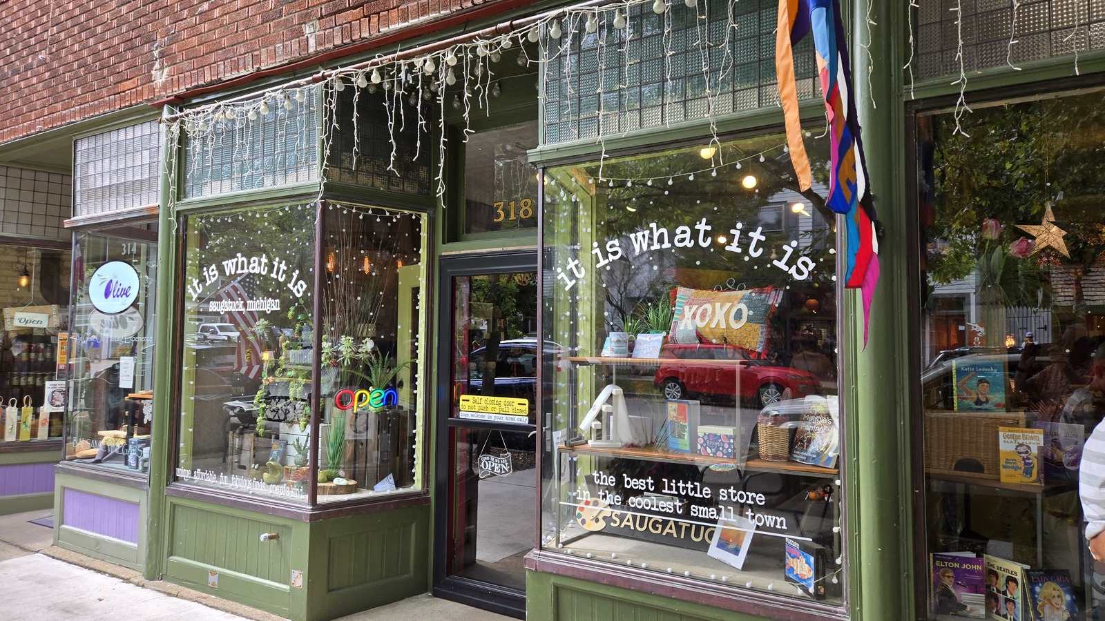 Green storefront of It Is What It Is on Butler Street in Saugatuck