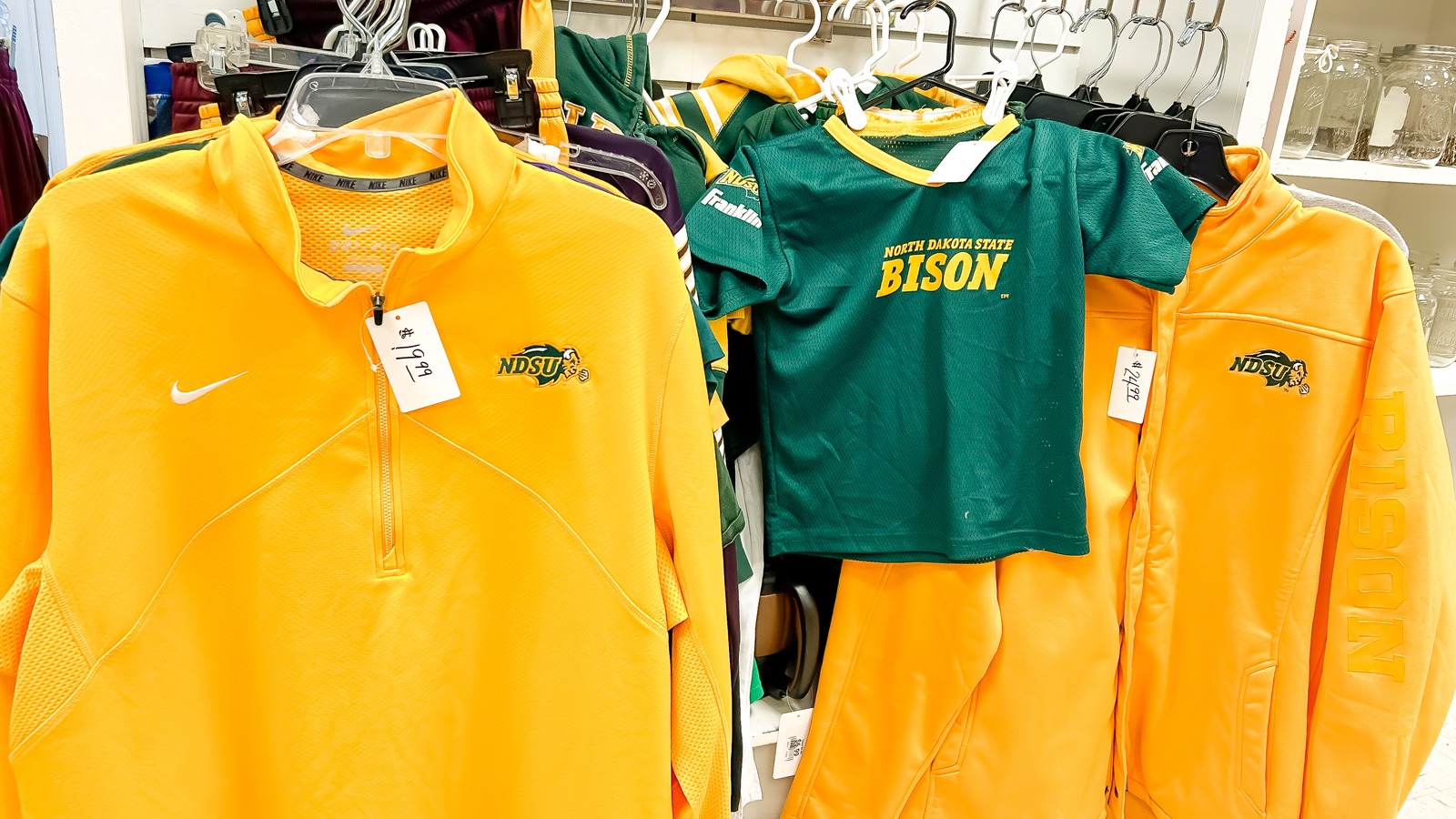 Colorful sweatshirts and clothing racks inside Welcome House in Fergus Falls