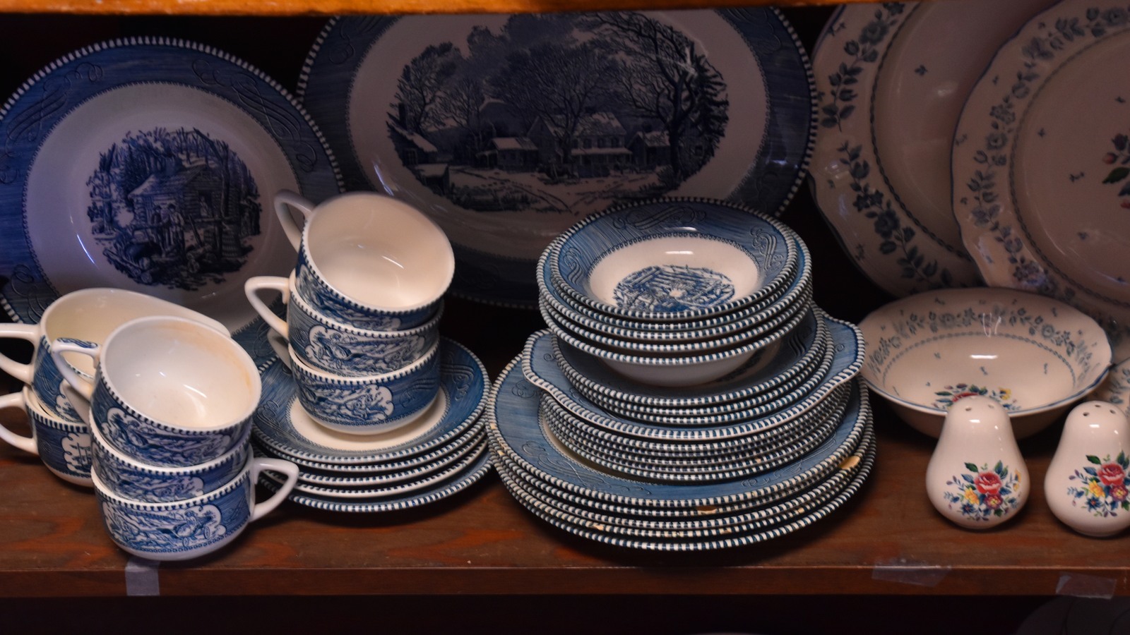 Blue and white china, cups, bowls, and serving plates at Treasure Cove Thrift Shop
