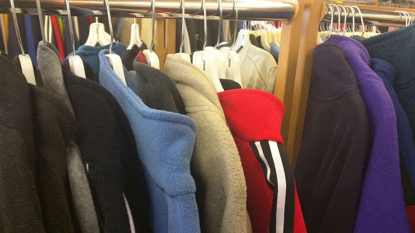 Colorful jackets and clothing racks inside MyUnique Bronx near Yonkers