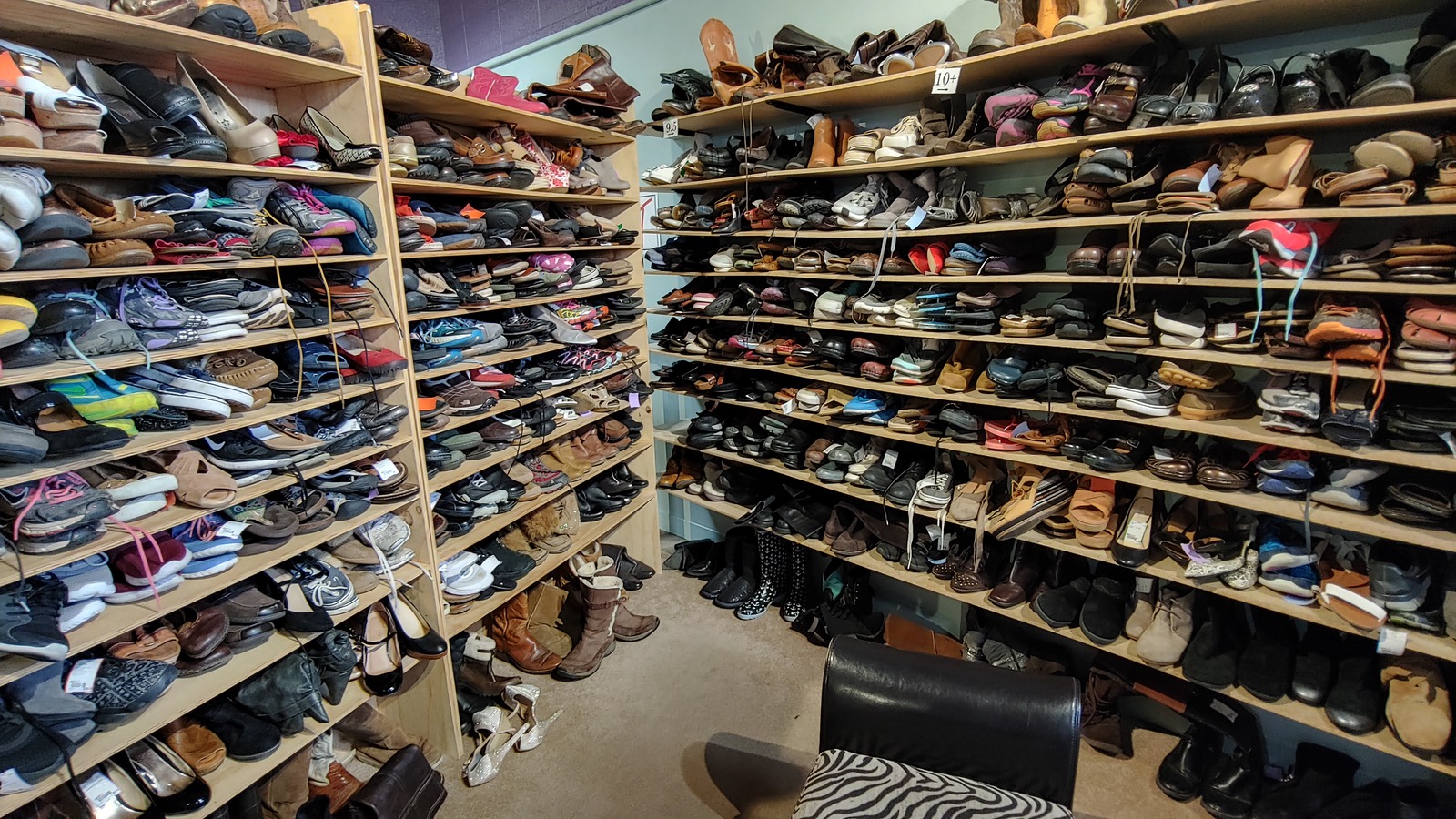 Shelves of boots, sneakers, and dress shoes at NU2U in Laramie