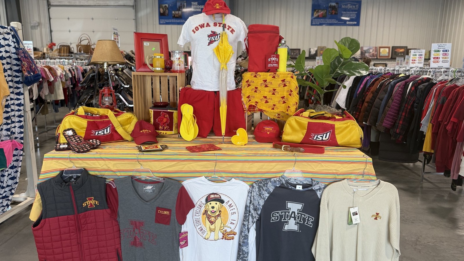 Seasonal clothing and colorful displays at Overflow Thrift Store
