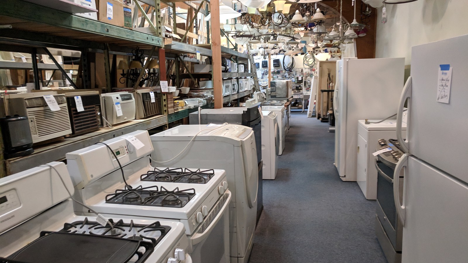 Rows of secondhand appliances at the Habitat ReStore in Ames