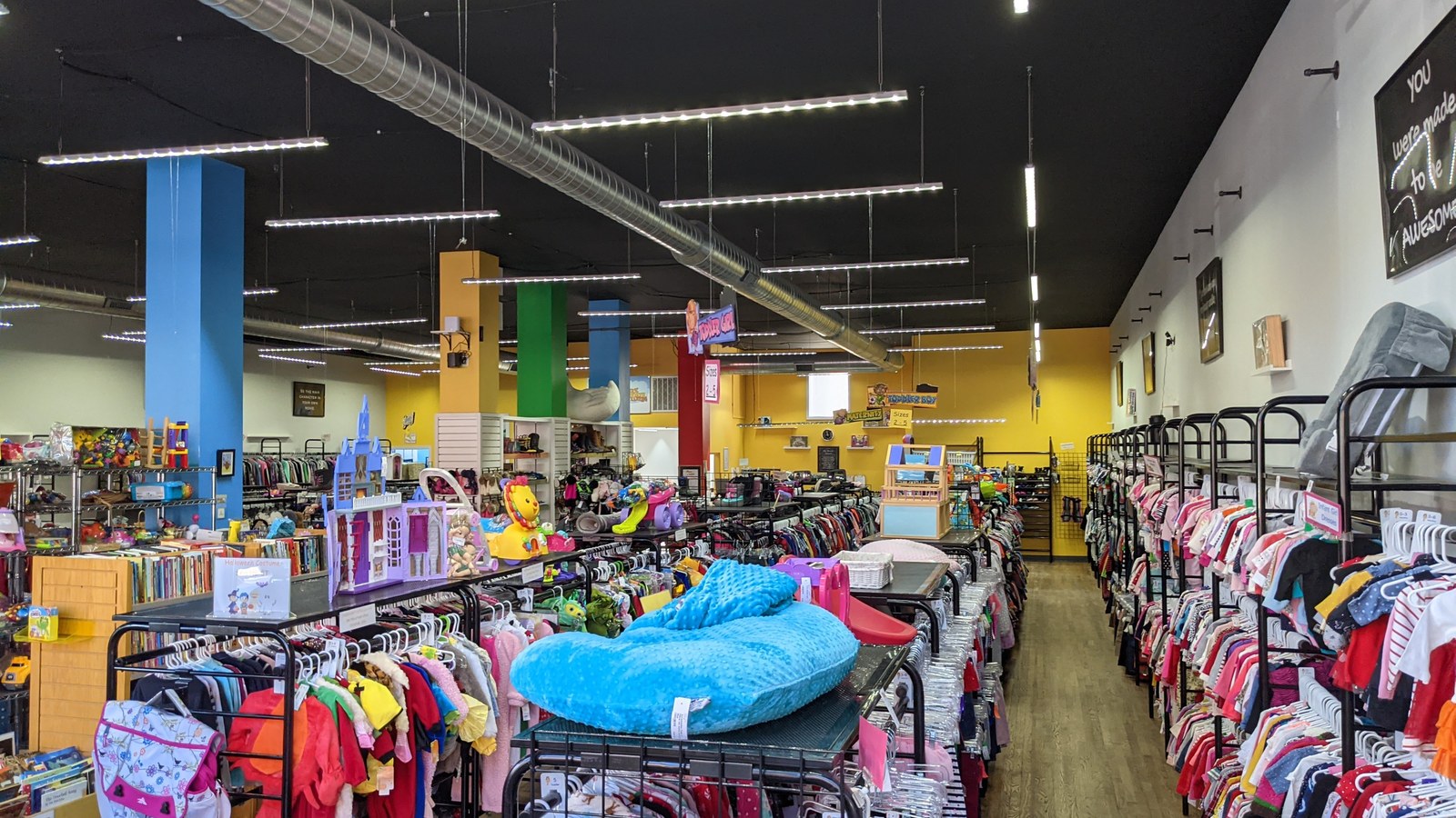 Children's clothing, toys, and books inside Duck Worth Wearing