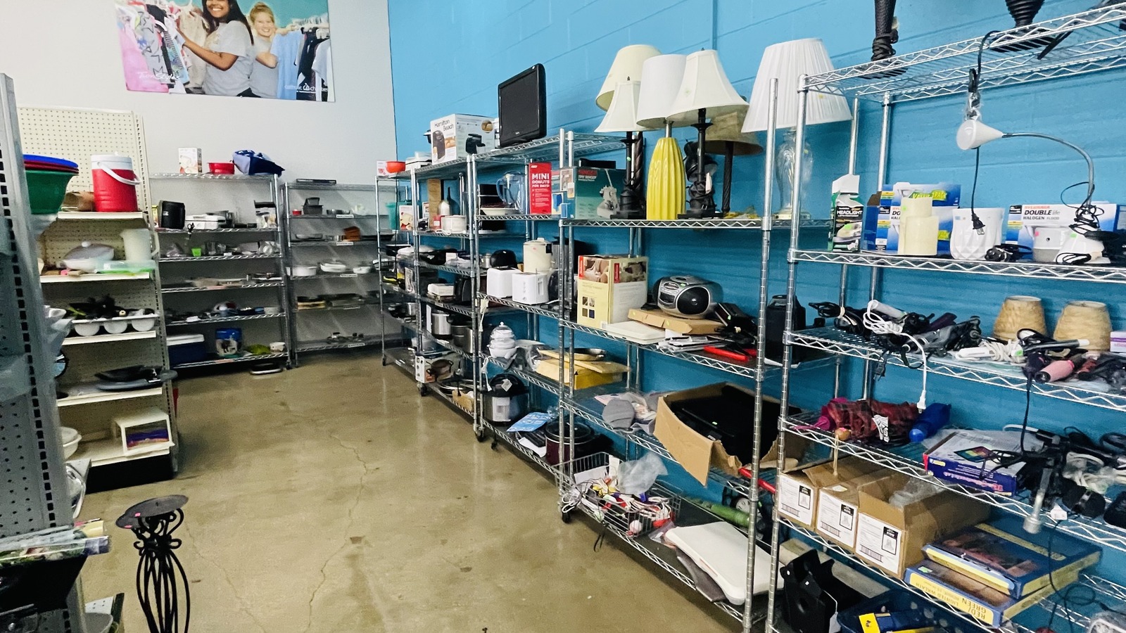 Organized shelves of housewares and decor at TurnStyles Thrift near Lenexa