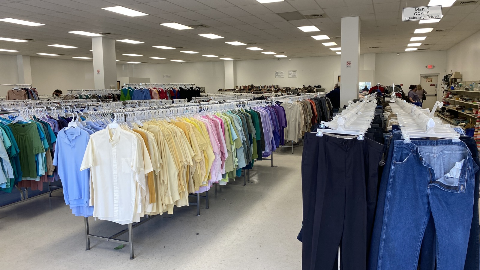 Color-organized clothing racks inside Goodwill in Southern Pines near Pinehurst