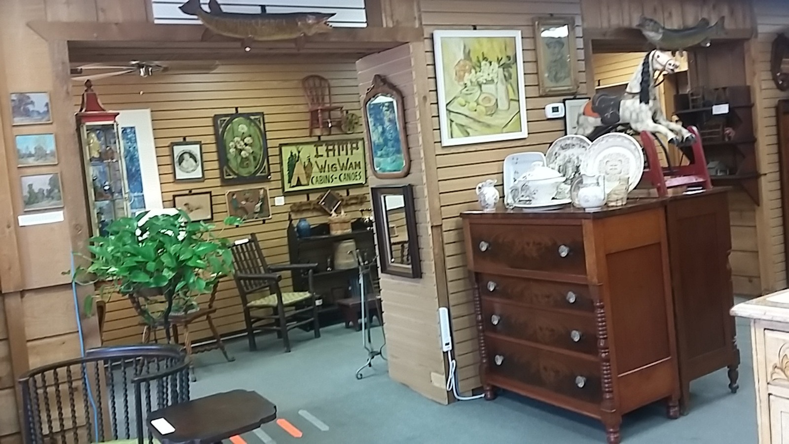 Framed art and period furniture at America's Heritage Antiques in Hayward