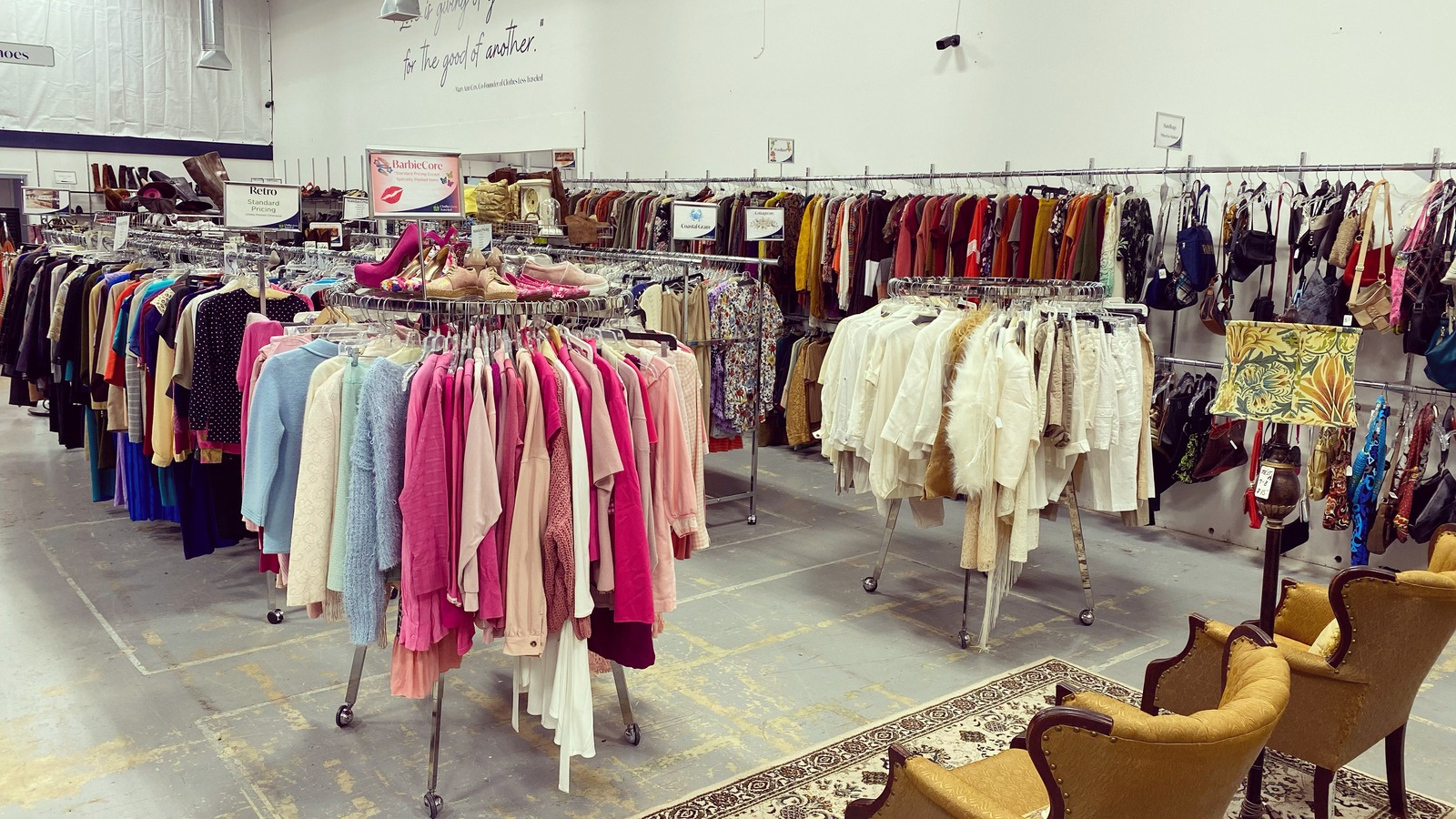 Organized clothing racks inside Clothes Less Traveled Thrift Shop in Peachtree City