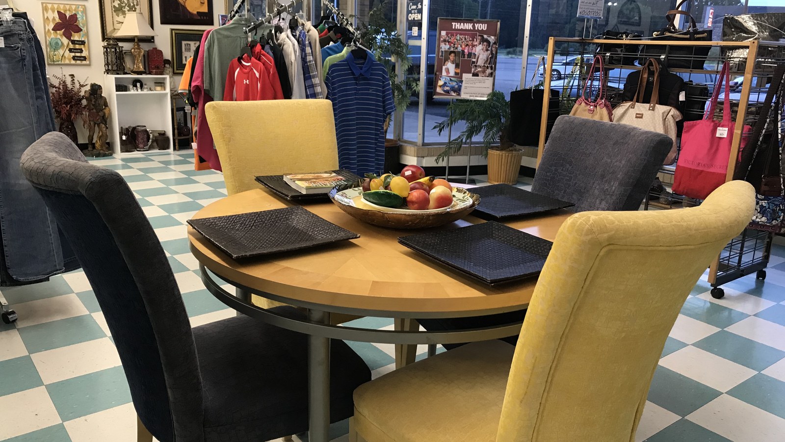 Dining table, chairs, and home decor inside Treasures in Longview